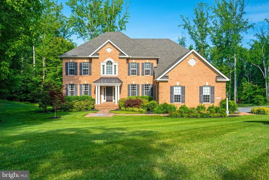 Meticulously maintained model Koch home w/ the absolute perfect open floor plan and loaded with amazing upgrades.  No detail was overlooked! Gourmet kitchen opens to large, bright living spaces. Kitchen has fabulous Kitchen Aid appliance package, banks of white cabinets, a gorgeous island, large walk-in pantry and a workstation with lighted glass cabinets. Back stairs lead to wide hallway and the outstanding owner's suite w/beverage bar, lovely spa bath. Walkout lower-level is perfect for an  in-law suite and boasts high ceilings, full-sized windows and a great workout room. Entertain on the maintenance-free spacious deck with enough room for dining and lounging. First floor laundry with laundry chute, great storage and closets throughout. 3 car garage with Tesla charger. Backs and faces forest/open space and on 1.42 acres. Quiet location yet just minutes to Rt.50/Shops/Restaurants. Davidsonville Elementary district!