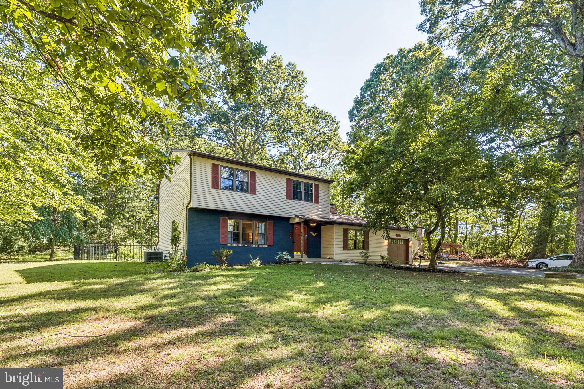 Located in the desirable Wissahickon School District, 1656 Penllyn Blue Bell Pike is tucked back off the main road on over an acre of land. The main level of this home is designed with a natural circular flow that feels both open and welcoming, but still provides separate living spaces. To the left of the entry, the sunlit living room leads seamlessly into the dining area, which then flows nicely into the kitchen. To the right, a den with a wood-burning fireplace and double doors to the rear patio offers another inviting space to gather. Straight through the foyer, the renovated kitchen ties the floor together, featuring poured concrete countertops, a farmhouse-style stainless sink, stainless steel appliances, shaker cabinetry, and custom built-ins that wrap around the appliances for a clean, cohesive look.
Just past the kitchen, a hallway off the living room leads to a recently renovated half bath and a rear door to the patio & pool area. At the end of the hall is the laundry room, complete with washer, dryer, utility sink, new cabinetry, and interior access to the garage.
Upstairs, the primary suite offers plenty of space with two large closets and a newly renovated private en-suite bath featuring a double vanity, built-in shelving, and a tiled shower. Two additional bedrooms, each with ample closet space and natural light, provide flexibility for bedrooms, a home office, or creative space. The full hallway bathroom has been fully renovated and includes an oversized vanity, tub-shower combo, and extra storage above the toilet. A spacious linen closet in the hall adds even more convenience for extra storage needs.
The basement is divided into two generous sections. The finished side offers a large, versatile space that can easily serve as a second living area, media room, or place to relax. The unfinished side provides plenty of storage and includes a workbench, making it ideal for projects, hobbies, or organized storage needs.
The front yard offers a long driveway leading up to the house, with ample parking space for friends and family, and a 1-car garage attached garage with a new door and opener. Lush greenery adds to the curb appeal, while the chicken coop adds some suburban charm and unique character.
Out back, the property transforms into a private retreat. A fenced-in pool and hot tub are surrounded by a concrete patio with space for both dining and lounging, perfect for entertaining or relaxing. Two sheds, one with electricity, provide flexible storage or workspace, while the surrounding trees create a serene backdrop.
This home is near both the Pennsylvania Turnpike and the Blue Route, and also has easy access to places like Plymouth Meeting Mall and Fort Washington State Park. Schedule your tour today!