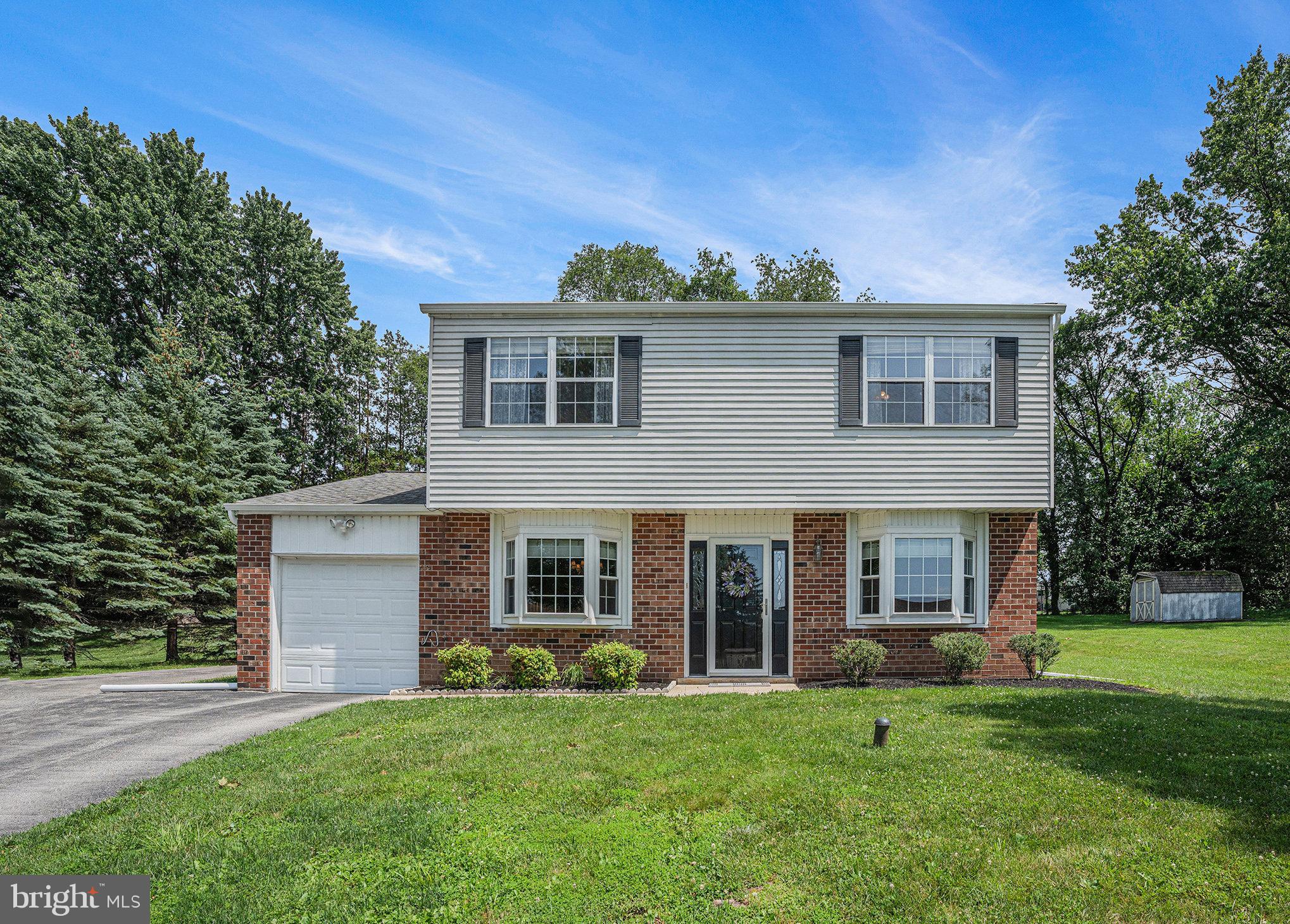 Welcome to this lovingly maintained East Norriton colonial located on a picturesque tree-lined street in Kimberly Knoll! Spacious, warm and accommodating, you’ll be charmed by this home’s classic layout, thoughtful updates, and inviting atmosphere. Step inside to find the spacious formal living and dining rooms, both highlighted by newer bow windows that fill the space with natural light. The updated kitchen features a smooth-top range with convection oven, recessed lighting, and a Bosch dishwasher—ideal for preparing your favorite meals. The adjoining breakfast room offers a serene view of the private, expansive backyard. The family room is anchored by a timeless wood-burning brick fireplace and French doors that open into the sun-drenched sunroom—a perfect spot to enjoy your morning coffee or unwind with a good book. A well-sized laundry room with closet storage offers access to the rear yard and the attached one-car garage, enhancing the home's practicality. A convenient powder room completes the main level. Outside, the fabulous yard features partial fencing and a lovely paver patio—an ideal space for outdoor dining, gardening, or simply enjoying the peaceful surroundings. Upstairs, the primary suite boasts an updated private bath, a separate dressing area, and two generous walk-in closets. Two additional bedrooms, a full hall bath, and pull-down attic stairs for extra storage complete the second floor.
Additional upgrades include a newer front door and storm door, luxury vinyl plank flooring, and newer gutters and downspouts. Tucked away in a prime location just minutes from Whole Foods, Farm Park, dining, shopping, and easy access to major highways. Picture yourself here—don’t miss this opportunity to make this well-cared-for home your own!