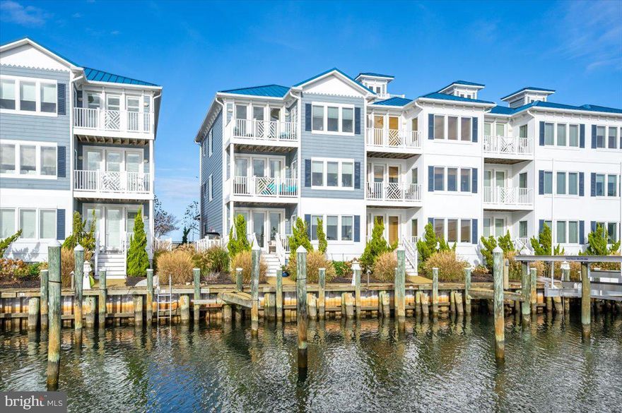 Gorgeous 3-level, end unit townhome with private elevator in highly desirable West Ocean City. Hard to find deeded boat slip with brand new 16,000 lb boat lift. This is the only end unit available for sale, with 2 car garage, off street parking & close to the pool. 3 bedrooms includes primary suite & jr. primary, 4 full baths with tile surround showers. Close proximity to Restaurants, shopping and the Ocean City boardwalk.

As close as you can get to Ocean City without OC taxes. First floor: enter the foyer through the front door or the two car garage. You will find a laundry room and family room with wet bar and full bathroom. Step out onto the marina side deck that leads down to the private marina with your own deeded boat slip #10 with new 16,000# boat & jet ski lift & the community pool.

Take the stairs or elevator to the 2nd floor where you will find the large gourmet kitchen, living & dining area. Featuring hardwood floors, granite countertops, gas fireplace & enjoy the marina views from the 2nd floor deck. Also located on the 2nd floor is a spacious bedroom with huge full bath. Take the stairs or the elevator to the 3rd level living area which includes the primary suite with flex area/office area and a junior primary suite. Take in the views from the 3rd level, enjoy the views of the Marina, Pool, Ocean City skyline & the most gorgeous sunsets! Villas at Inlet Isle features luxury waterfront living.

Heated outdoor pool, marina boardwalk, water & electric at your deeded slip, enjoy dining & entertainment close by walk/bike  or drive to numerous restaurants.

New HVAC that handles first and second floor installed Fall 2023. Settlement is contingent on the seller identifying and going under contract on a replacement property.