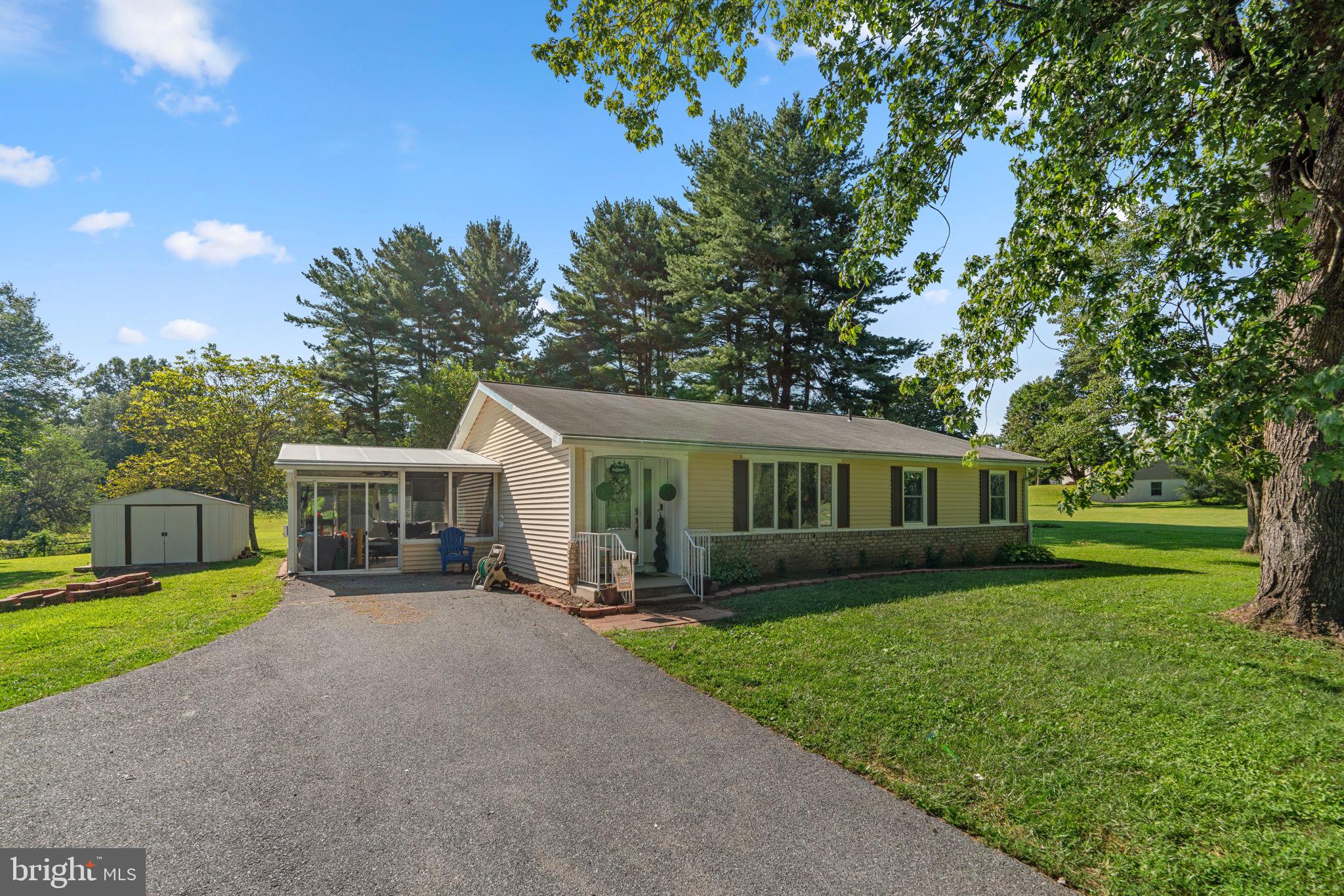 Welcome to your peaceful retreat on nearly 3 acres in Sykesville’s scenic Lynn Lee Park. This lovingly maintained rancher offers three bedrooms and two baths on the main level, a spacious eat‑in kitchen (2017 remodel with Whirlpool appliances), family room with fireplace and slider to the sunroom, plus a bright living room with a bay window. The lower level features a generous recreation room with a pellet stove and includes partially unfinished space, giving new owners the opportunity to customize it to suit their needs. Enjoy outdoor privacy and space for gardening or entertaining, along with a detached 28×24 two‑car garage. Ideally located near historic downtown Sykesville with shops, museums, as well as recreation at Piney Run Park. Easy commuting via MD 32 to Baltimore, Columbia, and metro transit just minutes away.