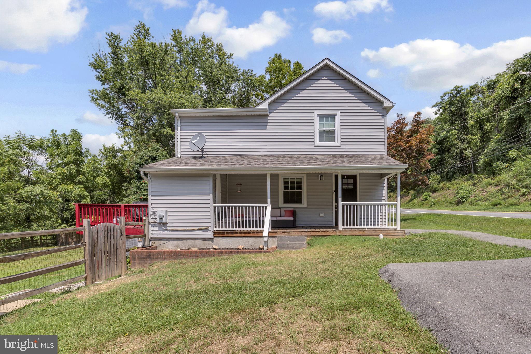 Beautifully updated farmhouse on nearly an acre, fully renovated in 2021, with a stunning kitchen, fenced yard, and no HOA or city taxes! This home offers open and comfortable living spaces. The main level features a bright living and dining area, and a stylish kitchen with white cabinetry, granite counters, stainless steel appliances, and rich wood floors. A main-level bedroom with its own bath adds convenience, while upstairs you’ll find two spacious bedrooms connected by a large bath. Outside, enjoy a fenced backyard, mature trees, a storage shed, and a large driveway with plenty of parking. With no HOA or city taxes, this home is just minutes from downtown, Wegmans, shopping, dining, and major commuter routes. Move-in ready with plenty of potential to make it your own