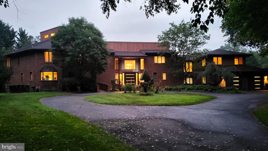 Experience luxury and privacy in this magnificent full brick home situated on 4.5 acres of tranquil, secluded lot. This stunning property boasts 7 bedrooms and 6.5 bathrooms, offering ample space for family, guests, and entertainment. Designed with a contemporary layout, the home features a spacious open floor plan and an abundance of natural light. Main floor has a separate in-law suite with a bedroom, full bath, living room, and separate ramped entrance- an ideal retreat for guests or extended family. Outdoor living is exceptional with a pool, lush garden, and a private practice green for golf enthusiasts. The expansive grounds offer limitless possibilities for recreation and relaxation. A 6-car garage provides ample storage for vehicles, hobbies, or equipment. This property is a rare find for those seeking a private, luxurious retreat in a secluded community.