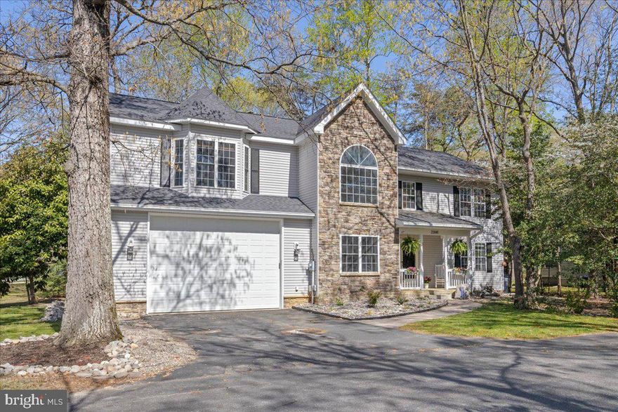 Welcome to this beautifully maintained home in the desirable Wildewood community, offering 4 bedrooms, 3.5 bathrooms, and a wealth of thoughtful upgrades. Nestled in a desirable neighborhood with a nearby playground, this home is perfect for anyone looking for space indoors and out! The stone-front elevation, paved walkway and lush landscaping lead you right to the welcoming front porch, adding to the home’s curb appeal! Inside, you’ll find hardwood flooring greeting you in the hallway and flows right into your two-story living room with large windows allowing natural light to flood the space. This room is complete with a gas fireplace to set the mood and your own personal work-from-home room, with gorgeous built-ins & pocket doors! The modern kitchen is a chef’s dream with ample cabinet space, pantry cabinets, stainless steel appliances, granite countertops and room for a center island if desired. Adjacent to the kitchen is a formal dining/living space with access to your outdoor oasis! A large deck leads you to a year-round useful screened-in gazebo - perfect for outdoor dining in the spring, summer and fall. Just below, you’ll discover a hidden gem - a surprise hot tub for cold winter nights. This space overlooks a wooded lot and gorgeous landscaping. Upstairs, all bedrooms are finished with ceiling fans, custom closet organizers & just wait until you see the HUGE owner’s suite. This roam boasts a large walk-in closet and a spa-like en-suite bath with a walk-in shower, tile finishes, and generous linen storage. Another great feature of this upper level is the guest suite perfect for guests OR it is ideal for the person in the house who needs their own private bathroom. The expansive laundry room is designed for efficiency, complete with a folding station and built-in cabinetry. And for the hobbyist or traveler? An oversized garage with RV parking - a rare find for a community like Wildewood. This incredible home won’t last long! Make sure to check out the interactive floor plan!