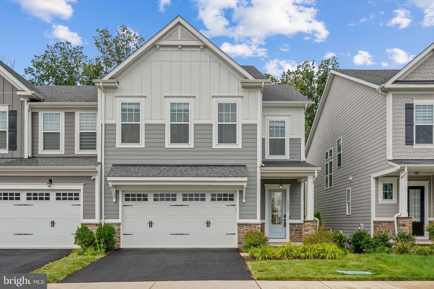 ***3.49% VA ASSUMABLE LOAN OPPORTUNITY for qualified VA Buyers***  585,313.67 Balance.  Mortgage is $3643.38.  Welcome to this stunning, newer built and ONLY available Villa in Potomac Shores , offering a spacious **3,100+ square feet** of finished living space with 4 bedrooms and 3.5 baths, designed for modern comfort and style. Step inside and be greeted by an impressive open floor plan that seamlessly connects the main living areas; the heart of the home is the stunning kitchen with upgraded quartz countertops, boasting a large center island with gorgeous waterfall edge and stunning farm sink.  Highlighting this beautiful kitchen are the under-cabinet lighting on the upper cabinets and also a practical walk-in pantry.  Adjacent to the kitchen, you'll find a dedicated dining area, a stylish half bath, and a practical mud area. One of the highlights of the main level is the breathtaking view of the surrounding woods, with expansive windows and a sliding glass door leading to a wonderfully sized partially covered deck, complete with a TV mount for outdoor entertainment. Throughout the main level, you'll appreciate the gorgeous luxury vinyl plank flooring, offering both style and easy maintenance. Upstairs, the primary suite is a serene escape with picturesque views of the woods, a modern, simple, yet elegant space that includes a luxurious en-suite bathroom featuring double sinks, a dedicated vanity, a spacious large shower, a separate toilet area, and a generous walk-in closet. The secondary bedrooms are also generously sized, each offering its own walk-in closet and sharing a well-appointed guest bathroom, while the laundry room on this level adds convenience with washer and dryer hookups. The finished lower level provides even more living space, featuring a versatile recreation room perfect for movie nights, a home gym, or a play area, alongside a fantastic custom full bath, a bonus room, and plenty of storage options. You'll never run out of hot water with dual 50gal water heaters either! The promise of a vibrant community life, coupled with the tranquility of this exquisite villa, makes it a coveted address, a place where memories are made and cherished.  * * * Residents of this esteemed community enjoy access to a suite of amenities that enhance the living experience. From leisurely strolls along scenic walking trails to refreshing dips in the 3 swimming pools, every day brings a new opportunity for enjoyment and relaxation. One of the pools is an easy 3 minute walk from this home! * * * HOA Fees includes Verizon 1GB FIOS high speed internet * * * For golf lovers, the Jack Nicklaus Signature Course is a notable highlight. Additionally, future VRE train station is in the community and just minutes from your front door. A public commuter lot is a short 4 miles away. These features significantly simplify commuting, making this an ideal location for convenience and leisure.  Get your tour scheduled today!