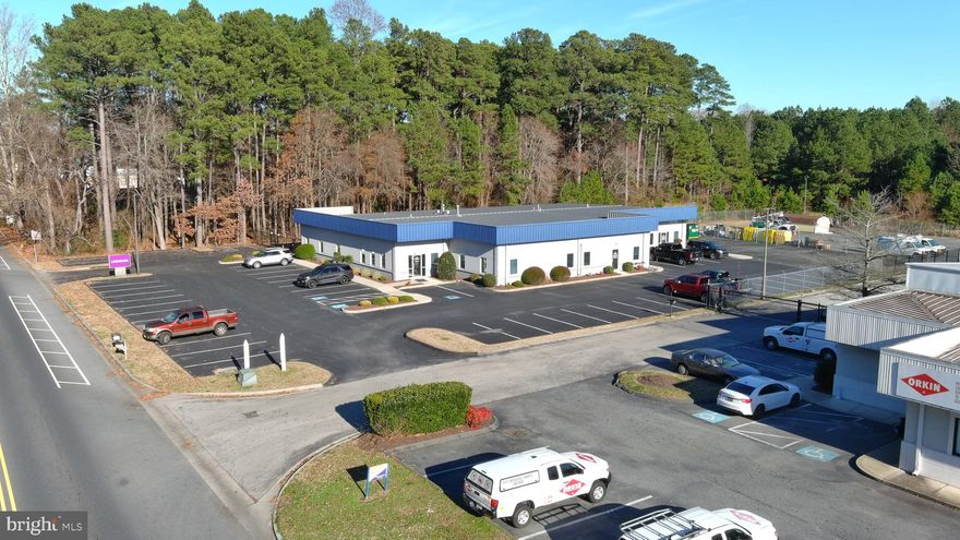 Large Class A office building located in the Salisbury Industrial Park.  Roughly ½ a mile from the Rt50/Rt13 Bypass on/off ramp on Northwood Drive.  Currently configured into 19 private offices, 2 conference rooms, server room, large 1,000sqft+ state of the art training facility, 750sqft climate controlled storage room, 506sqft of additional storage, large open area bullpen with 4 cubicles. Most of the FF&E will convey but everything’s negotiable. Additional 5,850sqft of parking available on the northside of the building which is fully fenced and gated.  Generator onsite in the event of an emergency. Roughly 70 parking spaces. Currently used as a single occupant building but it can be split into as many as 3 separate units without too much trouble.  Leasing options available upon request.