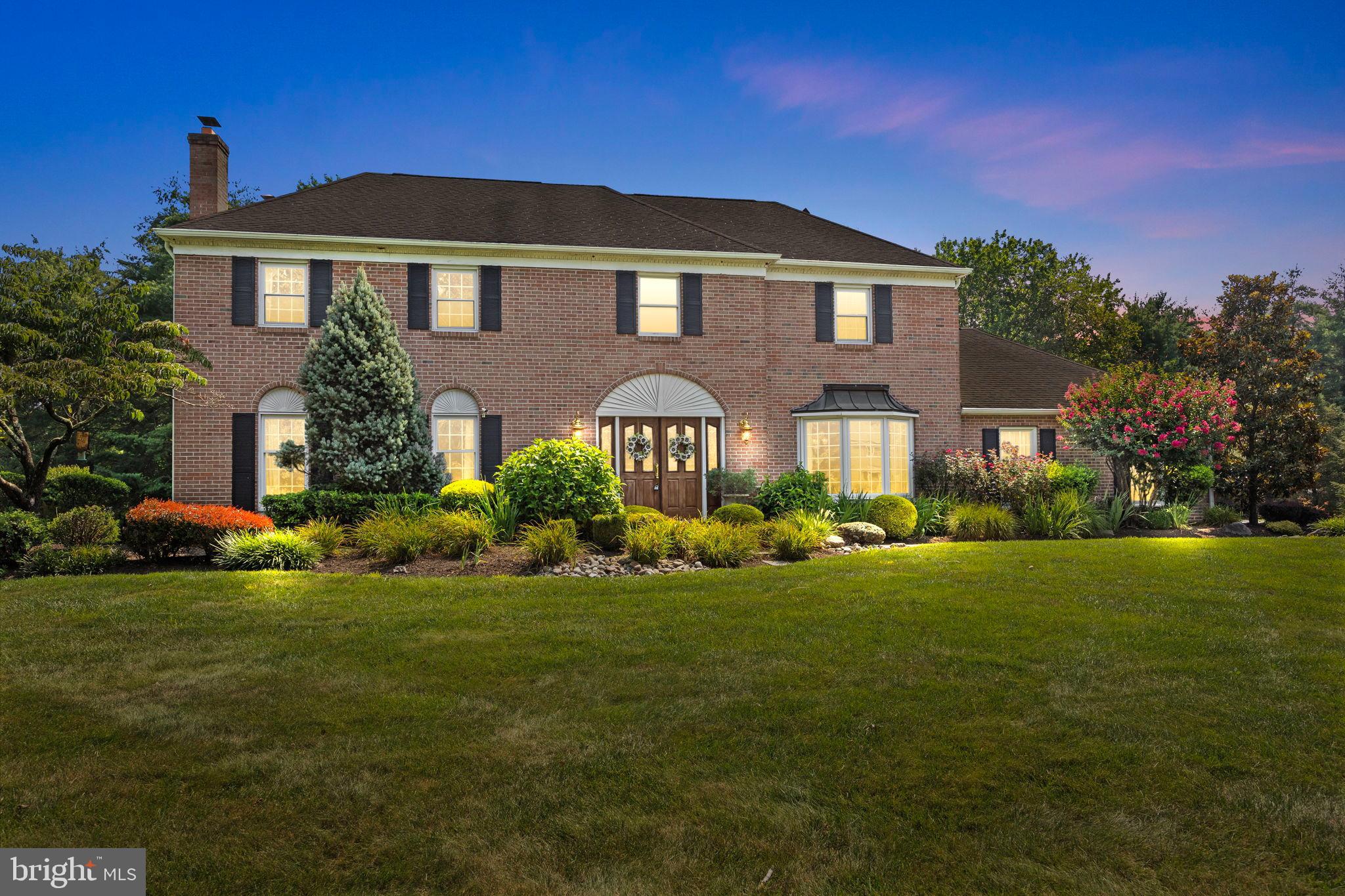 Highly desirable Makefield Chase proudly presents 1296 Heller Drive! With its classic curb appeal, generous layout, and prime location, this incredible 4-bedroom, 2.5-bath colonial with a 3-car garage is ready to welcome you home! The inviting entryway opens to a grand foyer with a stunning chandelier, elegant, curved staircase and striking hardwood floors that lead to the cozy living room with a wood burning fireplace. The formal dining room is filled with natural light from a charming bay window with a built-in window seat. Elegant crown molding, detailed chair rail accents, and a timeless chandelier with a decorative ceiling medallion create a sophisticated focal point perfect for everyday dining or formal entertaining. The beautifully updated kitchen features rich custom wood cabinetry, sleek granite countertops, and a spacious center island ideal for meal prep. Modern stainless-steel appliances add both style and functionality and a cozy eat-in area with French doors opens to a covered deck, offering scenic views of the lush backyard. The bright and inviting family room features a propane fireplace with a classic red brick mantle and a bay window with a built-in window seat perfect for showcasing plants or enjoying the view. Leading to the garage entry, you will find a small office area with access to the deck/backyard area. A well-appointed half bath completes the main level. Upstairs, the primary suite is your own private getaway, complete with a walk-in closet, sitting room/office area, dressing space with a makeup vanity, and access to the laundry room area. Enjoy a spa-like atmosphere in the beautifully update primary bathroom with a deep soaking tub surrounded by elegant tile work with a stylish mosaic niche, double vanity with rich granite countertops and abundant cabinetry that offers both style and storage. This space is flooded with natural light from a large skylight and a bright window, enhancing the serene ambiance. The modern shower is covered in neutral toned tiles with a glass enclosure along buttress walls. Three more spacious bedrooms are on this level with ceiling fans and carpeting and share a full hall bath. Adding a vast living space, the lower-level features gleaming newer engineered wood flooring and allows for several activity, media and/or storage areas. Outdoor living is at premium with a gorgeous, expansive covered deck with a paneled ceiling, recessed lighting and ceiling fans for comfort and ambiance. The inviting outdoor space allows for various seating options including a porch swing to take in the relaxing and serene private backyard views with mature trees and landscaping. This beautiful home is outfitted with energy saving solar panels (see agent notes), sprinkler system, and large backyard shed. Located within the award winning Pennsbury school district, just minutes from the restaurants of Main St in Yardley and with easy access to commuter routes, Interstate 295 to Princeton, Philly or New York. Don’t Wait to Come See this Stunning House and How You Can Make This Your NEW HOME!