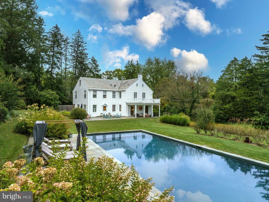 Live authentically. Nestled amidst the enchanting landscape of Ruxton, a pristine classic white farmhouse from the 1920s emerges, beautifully blending the essence of a bygone era with a modern twist. This timeless residence, resplendent with its graceful charm, transports you to a world far removed from the hustle and bustle, while maintaining its closeness to all the desired destinations.

As you approach this architectural gem, it effortlessly exudes the tranquil aura of the countryside, inviting you to explore its wonders. The focal point of the outdoor oasis is a deep azure pool, nestled harmoniously within its natural surroundings. Every gaze is met with lush greenery that sprawls in every direction, an exquisite tapestry that captivates the senses.

The grounds are a symphony of carefully curated elements—a harmonious blend of garden beds, mature trees, and open spaces. One of the many attributes that sets this property apart is its understated yet irresistibly comfortable outdoor living areas. Here, you can pull up a lounge chair, surrender to the moment, and let the world fade into the background. The dragonflies dance around, adding a magical touch to this idyllic retreat.

Even as the seasons change and fall descends, the allure of this haven remains undiminished. Gather around the fire pit, its warm glow extending the outdoor enjoyment well into autumn. This is a home meticulously crafted for the art of living, where every day feels like a celebration of life's simple pleasures.

And then, there's potential within this expansive property—a canvas upon which your dreams can take shape. A possibility to create an additional building lot, or perhaps donate a piece of this enchanting land. The grounds themselves are an expansive playground, inviting you to frolic, explore, and embrace the beauty that surrounds you.

Stepping inside this farmhouse, you are greeted by an eclectic style with a subtle maximalist undercurrent. It beckons you to envision the possibilities, to unleash your creative spirit, and transform this dwelling into your personal masterpiece. The old soul of this home patiently waits for your aesthetic to leave its indelible mark.

In the cherished Ruxton locale, this residence stands as a testament to timelessness and grace. It is a rare offering, waiting to be reimagined. Picturesque and soothing in its outdoor living, it invites you to become a part of its storied history—a home that yearns for your unique touch, a place where the past meets the future in perfect harmony. Cultivate your existence. The art of uniting human and home.