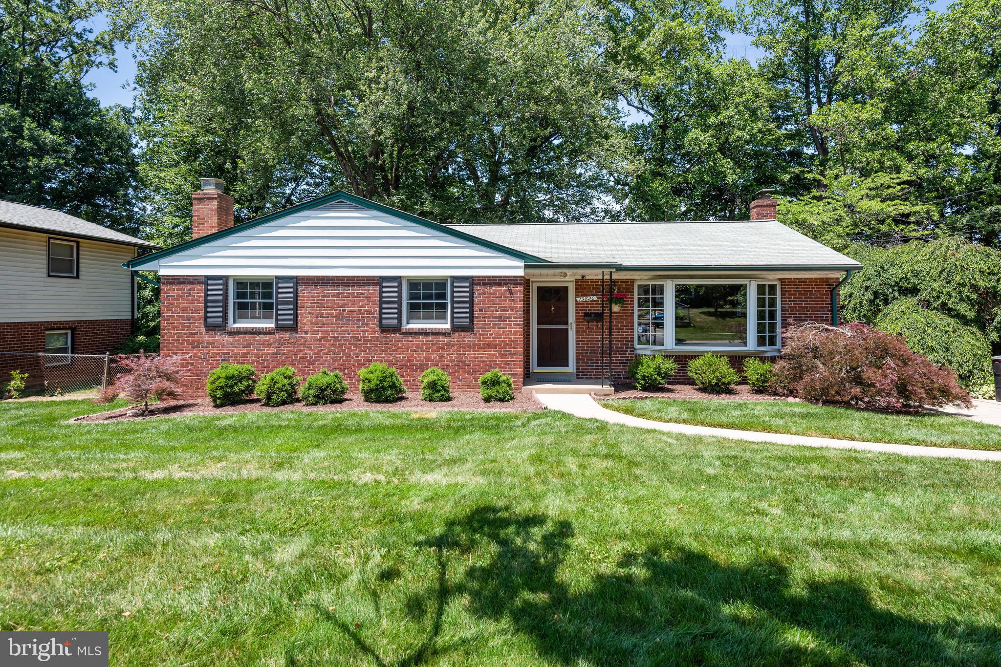 A well-cared-for gem of a 3 bdrm/2.5 brick rambler. Beautiful hardwood floors and crown molding throughout the main level, plus an oversized bay window that bathes the main level in natural lighting. Living space is maximized via an uninterrupted open floorplan for the living room and adjoining dining area. Large separate kitchen with SS appliances, ceramic tile flooring, plenty of cabinetry, and big enough for adding a bistro table or fun sideboard to complete your aesthetic. Three large bedrooms and two updated full baths on this same main level. Lower level has been made fully functional with a big common living space, woodburning fireplace and welcoming hearth, built-in bar area, and new carpet. Additional area for exercise or crafts, a half bath, and useful storage room. The exterior is what really sells this home: a two-tier deck, a nice flat rear yard, mature landscaping with an annual monarch butterfly invasion, a concrete private driveway for at least two cars. This Aspen Knolls neighborhood is leafy and quiet, but convenient to all the dining and shopping of downtown Rockville, downtown Rio, Connecticut, Georgia Ave, Norbeck, Routes 270, 370 and 200. Home is within a very short distance to elementary and middle school and just over a mile to the high school.