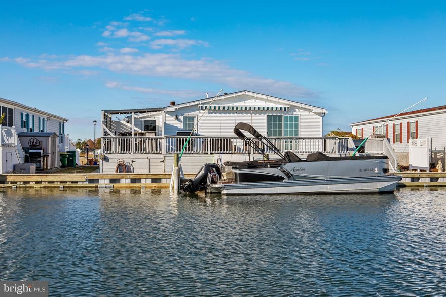 Motivated Seller. WATERFRONT LIVING AT ITS FINEST! Experience life on the canal with direct access to Rehoboth and Indian River Bays—no traffic required! This well-maintained 3-bedroom, 2-bath home offers 1,680 sq. ft. of open living space featuring a bright coastal design, ideal for year-round living or a perfect vacation getaway.

Interior features include LVP flooring throughout, upgraded countertops and cabinetry, stainless steel appliances, modern light fixtures, & more! The open floor plan provides a seamless flow between the kitchen, dining, and living areas. The owner’s suite offers private deck access with beautiful water and canal views.

Exterior highlights include a wraparound deck, outdoor grill, wet bar, and plenty of space for entertaining. Enjoy leisure activities having a blast with your own a pool table. 

This property comes with your own private dock and bulkhead—fully owned! Ideal for boating enthusiasts and nature lovers alike.

Sold furnished (with some exceptions)— practically move-in ready! Don’t miss the opportunity to own this waterfront gem and enjoy coastal living at its best.

Your Waterfront Paradise Awaits! Call or Text to Schedule Your Tour Today! Community Requires Application & Approval from All New Prospective Homeowners. Background & Credit Check Situated within the picturesque city of Millsboro, DE, Mariner’s Cove is a pet friendly, mobile home community that is designed with comfort and convenience in mind. Just 10 miles from the Coastal U.S., Mariner’s Cove boasts such amenities as community organized activities, a boat dock and on-site management for your peace of mind. That’s not all Mariner’s Cove has to offer though. The community swimming pool offers you active options on-site, and the picnic area gives you the outdoor space required to enjoy your friends and family on those warm sunny days. You can participate in community organized activities like card games or Bridge, launch your boat or kayak from the dock, fish in the community lake, shoot billiards and play shuffleboard in the Clubhouse, and have the ear of on-site management for your peace of mind. Don’t miss out on this beach and boaters’ dream, schedule a tour today! Start living the good life by choosing Mariner’s Cove as your new community!