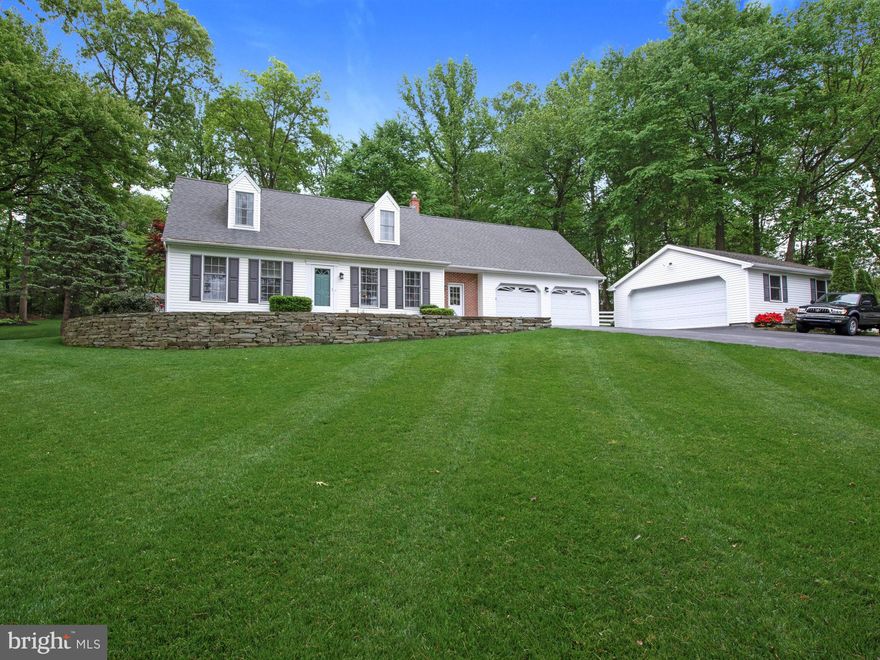 Well maintained, updated cape situated on a beautiful, semi wooded, professionally landscaped lot, just minutes to town, and less than a mile to the high school. The interior features an open floor plan, custom cherry kitchen,vaulted ceiling, large island with granite countertop, and custom white oak plank flooring. One floor living with 2 bedrooms and full bath on the main level. The upper level offers 2 spacious bedrooms, each with a walk in closet, and a full bath . More room to spread out in the finished lower level which includes chair rail,  a propane stove and outside entrance. Lighted outdoor entertaining area features a patio with fire pit, and large composite deck complete with vinyl railing.  Plenty of storage for your cars, toys and hobbies between the oversized 2.5 car attached garage, the finished 2 car detached garage, and large shed.  Owners pride shows throughout this meticulously cared for property.