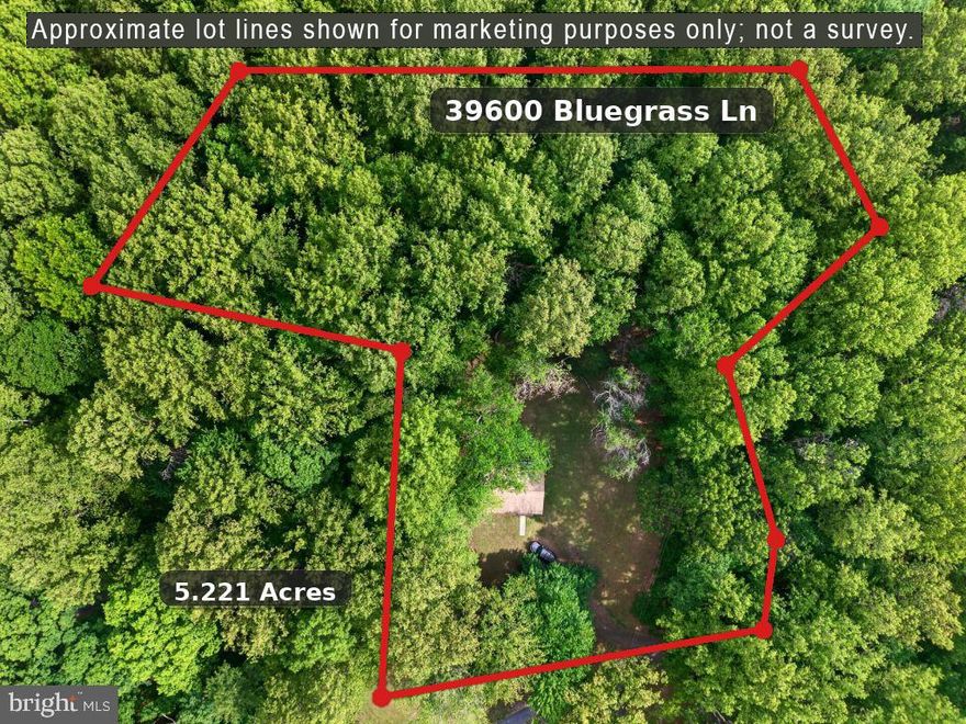 5.221 acres.  No HOA.  Has well and septic and electricity.  Home has no value.  Value is in land.  Land is flat.
