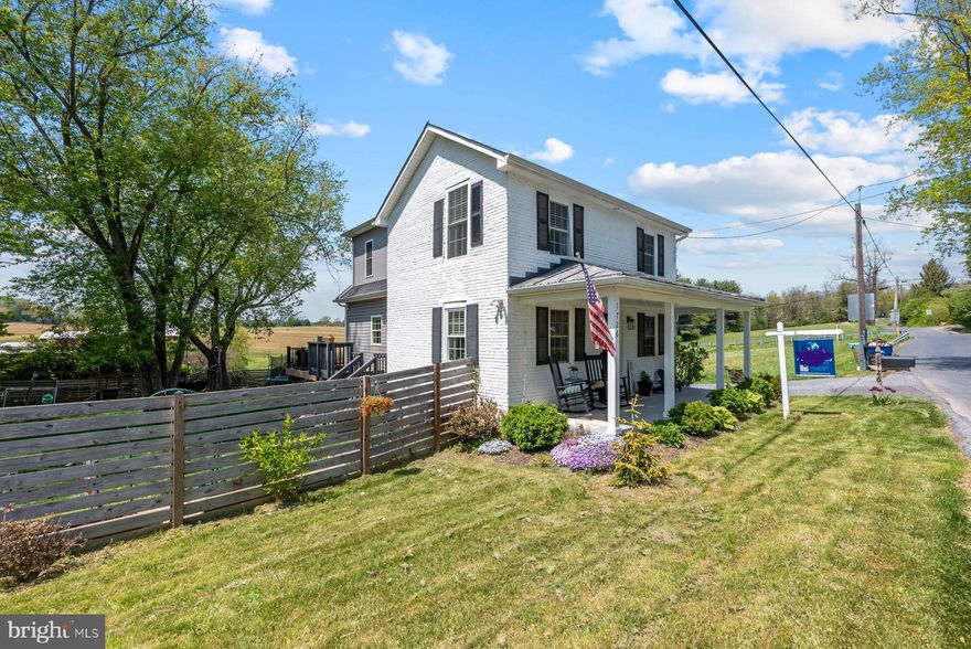 Move-in ready 3BR/2.5BA expanded Farm home located in the countryside of Westminster.  Parking is ample in the long double wide driveway as you make your way past flowering shrubs to the adorable covered front porch of your new home. Step into a beautifully maintained home featuring hardwood floors, an exposed brick wall, and so much character.  The main floor features a mudroom with custom built cubbies, a large living room, a beautiful kitchen, and a sunny dining room with built-in window benches.  The kitchen features stainless steel appliances, plenty of cabinets, a pantry closet, granite countertops with a subway tiled backsplash to the ceiling, and an island with a stainless farm sink with a butcher block countertops, and breakfast seating for three or more.  In addition, the main floor offers a half bath and a laundry room.  On the second floor are two sizable secondary bedrooms, a full bath with tile from tub to ceiling, and a spacious primary bedroom.  The primary features a large walk-in closet and a private full bath with a walk-in shower.  There is an unfinished cellar which can be accessed from the outside and host utilities.  From the living room, sliding doors take you to a large wrap-a-round trex deck that overlooks the tons of green space and shade trees surrounded by open land. In addition, the yard features raised gardening beds all ready for your summer garden, and a detached garage/shed. This home is move-in ready with so much to offer new homeowners including being located within walking distance to the Old Westminster Winery, and in close proximity to shopping, restaurants, and commuter routes.