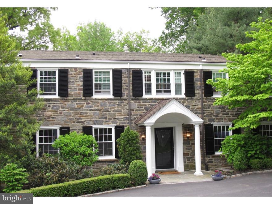 Nothing to do but move in to this stone colonial located on one of the most coveted streets in Lower Merion. Renovated throughout with a contemporary flair this home is truly unique for the Main Line.  The custom contemporary kitchen features walnut cabinetry with marble countertops and integrated appliances consisting of two Subzeros, Wolf range, and a wine refrigerator.  An open and bright eating area overlooks the tranquil rear yard complete with a heated pool and spa, and lush landscape creating a true private oasis. Off the kitchen is the cozy family room with double sets of french doors leading out to a spacious flagstone patio and pool/spa.  There is a lovely formal living room with gas fireplace and a separate office/study with a second marble fireplace (wood burning) and built in bookcases.  Plus a spacious dining room for formal entertaining.  The back staircase leads to a separate homework/office/prep space which can be concealed from the entry by a pocket door.  Upstairs find a lovely master bedroom suite with marble bath, walk in shower, whirlpool tub, and double closets.  A second bedroom suite with newly remodeled bath and walk in shower.  Third and fourth bedrooms share a newly remodeled bath.  The fifth bedroom/au pair suite also has its own new bath and private back stair access.  Finished basement ha a spacious sitting area with a stone fireplace and a separate game area plus a 5th full bath which is convenient for the pool.  Two laundry rooms (second floor and basement).  Wide plank flooring throughout, new windows, 6 panel doors, new custom light fixtures and overhead lighting throughout, 8 zone heat, 3 fireplaces, 3 zone ac, and newer hot water heater (2013),  2 car garage, circular drive and premier Northside Haverford location.  Walking distance to train, Suburban Square, shops, and restaurants. Enjoy the best of both suburban and city life-easy 20 minute commute to Philadelphia.