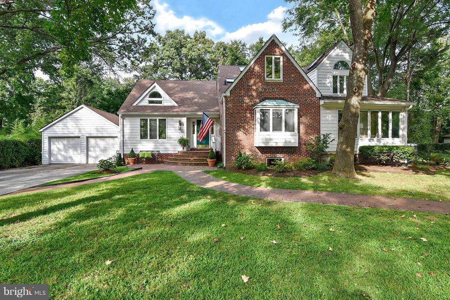 Wellington Estates, sited on three lots featuring six bedrooms, five full baths + au pair quarters. Expansive great room and gourmet kitchen,two fireplaces,refinished hardwood floors throughout,two car garage,screen porch. Multiple skylights and built ins galore.Main level master bedroom with cathedral ceilings  an and additional bedroom. Waynewood school and walk to shopping. Don't miss this one!