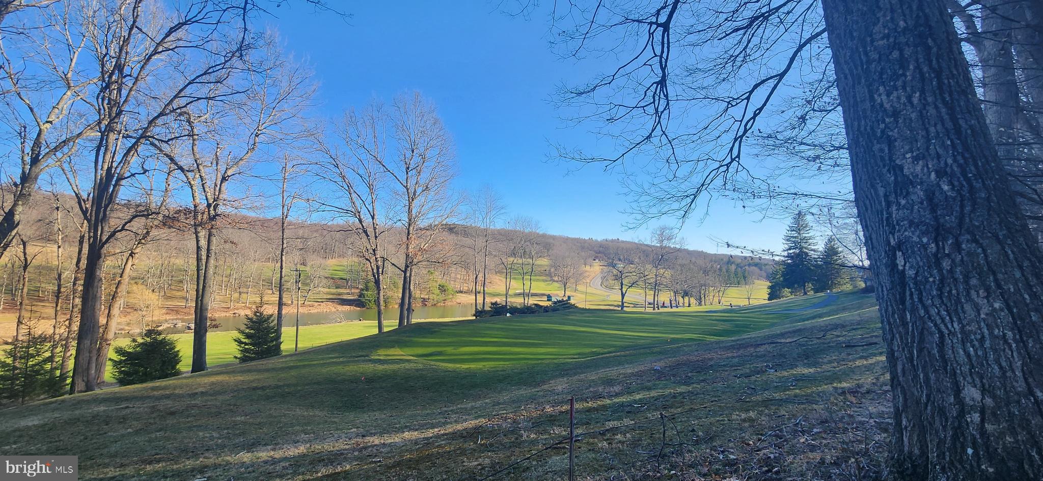 Rare opportunity! Impressive views of the Oakland golf course, pond and scenic vista! 5 lots in Country Club Acres Section 2, lots 66, 67, 68, 69 and 70, totaling 1.58+/- acres of land, all fronting on hole #13. Private driveway access already in place off Oakland Sang Run Rd. Public sewer nearby via Crosby Drive. Well water. One home can be built in total and there is flexibility on where you could build to maximize views or privacy.