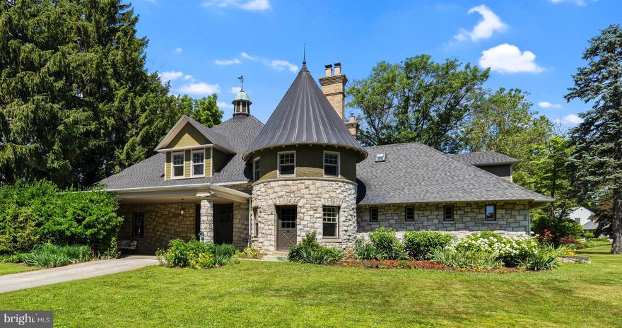 Welcome to the Conny Meade carriage house & stable! Constructed in 1902 for T. Ellwood Allison at the age of 24, he likely inherited significant funds from his grandfather that established one of the largest box car manufacturing companies in the U.S. As an adult, he was a significant player in real estate around Media. In the early 20th century, he owned over 150 acres that was developed for residential use. No expense was spared for the creation of this amazing building. Originally, the horses were kept in the northern third of the building. This section was crafted with white glazed brick interior walls that housed 5 stalls. The original stall dividers are crafted in iron with solid brass finials while each stall had brass metal rings used to hold the horses in place. Three of those dividers remain within this living space now! A pedestrian door is centered in the rounded turret portion that rises three stories. This cozy entry/sitting room is anchored by a large stone fireplace. Directly to the left of this entry remains the original carriage doors that provide access to a large un-finished storage room. The Southern third of this floor was for the storage of the carriages that retains all of the original beadboard walls and ceiling! Upon conversion to a residence, the floors were elevated and one of the barn doors was permanently affixed in place, while the other half of the barn door remains that still provides access to the storage room. Two of the original stall dividers were relocated to this space to provide a visual break between the dining & entertaining portions of this space. This one area is over 1,300 square feet! A spacious kitchen connects the two sides of the building that provides direct access to the rear yard & inground pool. There is also a breakfast room with built-in cabinets. The current owner has made significant enhancements using Bryant Phillips Construction to the 2nd floor as well as to the exterior of the home. All of 2nd floor walls & ceilings were removed to insulate the entire structure & the ceilings were raised 2’ to their original height. Both bathrooms were completely renovated & reconfigured. An entirely new HVA/C system was added that provides central air conditioning & heat to the entire 2nd floor. All of the windows on this floor were also replaced. The most significant change came in the turret bedroom! A custom series of curved bookshelves were crafted around the three windows with downlights installed. The ceiling was removed from the turret to expose the original structural elements. Insulation was added & a custom designed turret cap was installed higher into the space to allow for the addition of a ceiling fan. There is a wood burning stove in this space as well. At the end of the 2nd floor hallway is a door to even more (1,500 SF of unfished) space! The entire width of the southern portion of this floor provides further opportunities for the next stewards to expand the living space. As if that isn’t enough, there is a spiral staircase to a massive loft area that is centered under the main roof & cupola. A previous owner actually used this space for additional living (even though it is not heated) and installed plumbing in the loft! There is a toilet, a small clawfoot tub & a pedestal sink in this area that has been shut-off by the current owner. On the outside of the property, the current owner removed all of the vinyl siding that was installed by a previous owner and replaced it with Hardie plank boards & just repainted in 2023. There are perennial beds surrounding the front and side yards anchoring the building to the landscape with an abundance of blooms. There is a large covered portico over the carriage bay entry that is a great shady place to enjoy al-fresco dining. Just outside of the kitchen is a stone patio within the fenced area for the inground pool. Come explore the uniqueness of the Conny Meade carriage house & stable, and you too will fall in love!