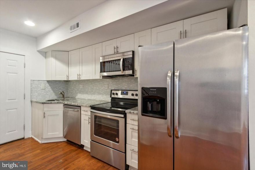 Welcome to this modern, tenant-occupied home at 1557 N Orkney Street, offering an excellent turnkey investment opportunity. The property features hardwood flooring throughout and an updated kitchen with new appliances, cabinetry, and granite countertops. The second floor includes a spacious bedroom with two closets and a private full bathroom, while the third floor offers an additional bedroom, full bath, and a convenient laundry room. Outside, enjoy a large private yard with direct street access. The property is currently leased through December 30, 2026, at $1,830 per month, providing steady income and an approximate 8% return on investment.