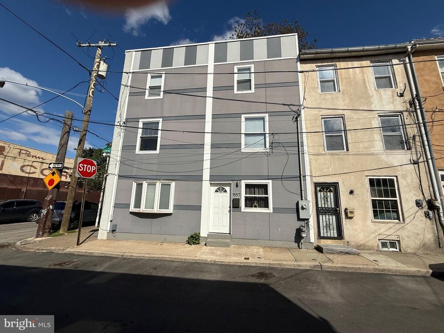 Welcome to this modern, tenant-occupied home at 1557 N Orkney Street, offering an excellent turnkey investment opportunity. The property features hardwood flooring throughout and an updated kitchen with new appliances, cabinetry, and granite countertops. The second floor includes a spacious bedroom with two closets and a private full bathroom, while the third floor offers an additional bedroom, full bath, and a convenient laundry room. Outside, enjoy a large private yard with direct street access. The property is currently leased through December 30, 2026, at $1,830 per month, providing steady income and an approximate 8% return on investment.
