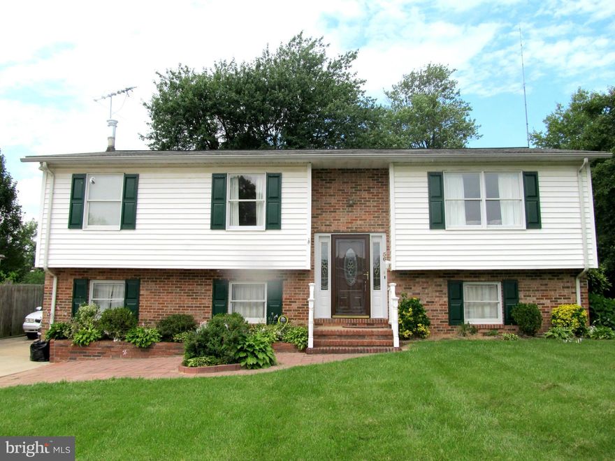 This lovely split foyer features 4 bedrooms, living room and family room in lower level!  Freshly painted throughout with beautiful hardwood floors, brand new carpet in lower level and new flooring in kitchen!  Rear deck overlooking large back and side yard!  Pack your bags and move right in!!