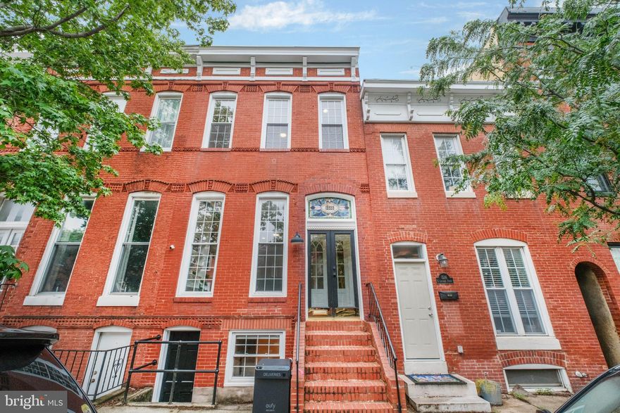 Exceptional Properties. Exceptional Clients. Welcome to 1518 S Charles!  This beautifully renovated home perfectly blends historic charm with modern comfort, offering luxurious living with impeccable design and craftsmanship. Step through the bright vestibule, complete with stained glass and French doors, to see gleaming hardwood floors, custom built-ins, and tons of exposed brick. As you make your way through the front living and dining area, you’ll find a stylish half bath and a stunning kitchen equipped with quartz countertops, KitchenAid appliances, custom cabinetry, walk-in pantry, breakfast bar, and tons of prep space. Just off the kitchen, the second living area has a working fireplace and leads out to a private patio and oversized detached garage. The serene primary suite on the second level offers a large walk-in closet and a spa-like en-suite bathroom, with a double sink vanity, gorgeous shower, additional vanity space, and a private deck to enjoy your morning coffee. Down the hall, you’ll find a laundry room, another full bathroom, and a second bedroom with large windows and beautifully maintained exposed brick. The third floor offers a flexible space that can be used as a third bedroom or entertaining area, complete with a wet bar, another deck, and full bathroom. The lower level adds even more versatility. This space can be used as a bedroom or private office with its own front entrance and large storage room. The property is also equipped with a full house reverse osmosis system. This home is an entertainer’s dream and just a few blocks from the shops, restaurants, and parks that make Federal Hill one of Baltimore’s most sought-after neighborhoods.