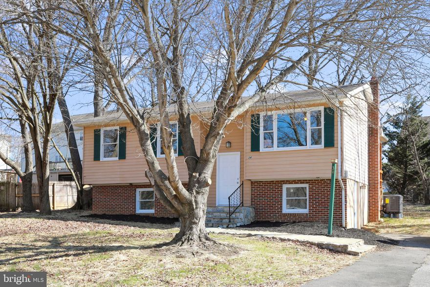 This split-foyer home has just been been beautifully renovated/upgraded conveying two finished floors.  It has 4 B/R,  l.5 Bathrooms with a floor plan that includes an open/adjoining dining and living room (with a ceiling fan), located on a beautiful treed lot.  It has a laundry room that houses the hot water heater and also with hook-ups for your washer and dryer.  Beautiful wood laminate flooring throughout the lower level which also has a bedroom and bathroom.  It also conveys with a large wood-heating stove in the family room with a wet bar.  The HVAC system is new.  When you go upstairs on the beautiful hardwood stairs, it also has the hardwood flooring throughout the upper level (except the kitchen).  The kitchen has beautiful cherrywood cabinets with a pantry and granite countertops.  You can walk out of the dining room onto a large deck almost the length of the house.  The portion of the deck off the dining room and kitchen has a roof over it with a ceiling fan; the rest of the deck is open.  Check out this home that could be yours because this won't last long!