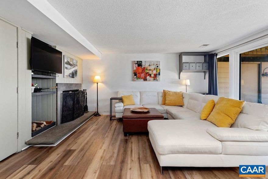 "The Highlander" on Eagles Swoop is for sale!  This highly successful short-term rental ground floor ski-up & ski-out condo is priced to move and has all the big-ticket improvements (Brand new TRANE HVAC, April 2025; Highest quality luxury vinyl tile (LVT) throughout, 2023; and newer washer/dryer, high-quality extra-large sliding rear door, and a large slope-view window changeout (all in 2021).  Ready to move-in or rent out!  This hard-to-find front door/back door accessible condo is located in the epicenter of the resort and all within a short two-minute walk to the Mountain Inn and ski-lifts and one-minute walk to The Market convenience store.  The back porch offers an amazing downhill view of the slope with spectacular views of the blue ridge mountains in the distance.  You also have a front row seat during the ski season, and at night the entire slope is illuminated.  This is a great find for both hikers and skiers, and it has the best location and view for the price in all of Wintergreen. Check with agent for showing availability. For five years this has been a 5-star highly popular short-term rental (VRBO/AirBnB) with consistent Super-host status. Gross income for 2023 ($27,579.69); 2024: ($26,013.50).,Fireplace in Family Room