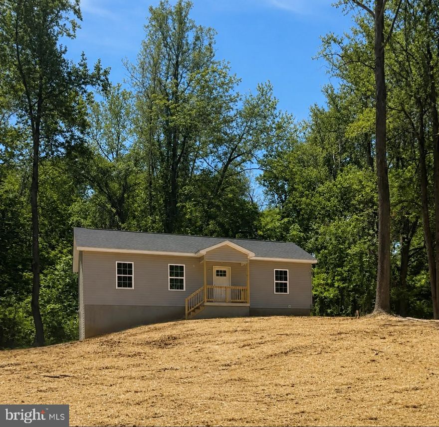 Brand-new construction situated on 1.5 wooded acres in the desirable community of John Brown Farm with deeded Shenandoah River access. This thoughtfully designed ranch-style home offers convenient main-level living with an open-concept layout featuring a spacious living room, dining area, and kitchen with center island. Durable luxury vinyl plank flooring runs throughout the home, offering a cohesive look with easy maintenance and no carpet. Just off the kitchen, you’ll find a dedicated main-level laundry room for added everyday convenience.

The split-bedroom floor plan provides privacy, with the primary suite featuring a walk-in closet and private full bath, while two additional bedrooms and another full bath are located on the opposite side of the home. The unfinished lower level offers excellent storage, workshop potential, or future expansion opportunities.

Enjoy peaceful wooded surroundings while being just minutes from Harpers Ferry, hiking trails, river activities, local shops, restaurants, and commuter routes. Whether you’re looking for a full-time residence or a weekend retreat, this property offers the perfect combination of modern comfort and outdoor lifestyle.