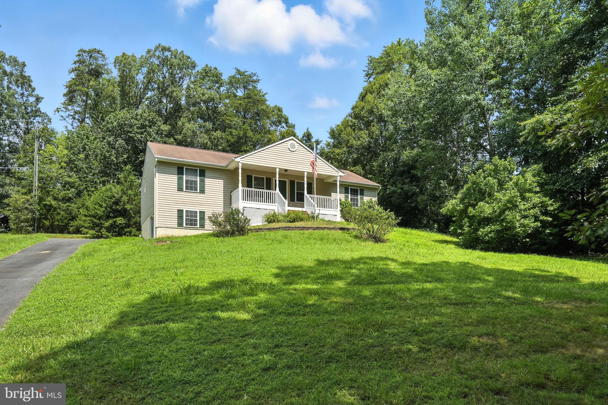 THIS PROPERTY IS ON AN ACRE...LOOK AT THE PLAT AND SEE HOW FAR BACK THE YARD GOES..YOU CAN HAVE A HUGE YARD IF YOU TAKE OUT SOME TREES!
NO HOA! Peaceful Retreat Close to Everything! FIOS AVAILABLE!! VIRTUALLY STAGED!
Welcome to your serene, private getaway — with no HOA AND WITH FIOS AVAILABLE...This home offers the perfect blend of quiet and convenience, ideally located near Quantico, the VRE, Potomac Point Winery, and Widewater State Park. Enjoy easy access to Route 1, I-95, shopping, and dining, all while feeling miles away from it all.
Step inside to an open floor plan with a split-bedroom layout that ensures privacy. The home features 3 spacious bedrooms and 2 full bathrooms. The full unfinished basement is ready for your personal touch—create a gym, workshop, or use it for extra storage. SELLER HAS ORDERED ALL NEW STAINLESS STEEL APPLICANCES WHICH SHOULD BE INSTALLED BY THE END OF THE MONTH!!
Start your mornings with a cup of coffee or relax at the end of the day, watching local wildlife from either the covered front porch or the back deck, both recently upgraded with low-maintenance composite/PVC decking.
Need fast internet? This home is already wired for VERIZON FIOS, making it perfect for work, streaming, or gaming.
Nestled in a quiet spot, away from road noise, yet just minutes from parks, boat launches, and outdoor recreation, this property offers the best of both worlds. Move-in ready with endless potential. Don’t miss your chance to call this peaceful retreat your own!
--