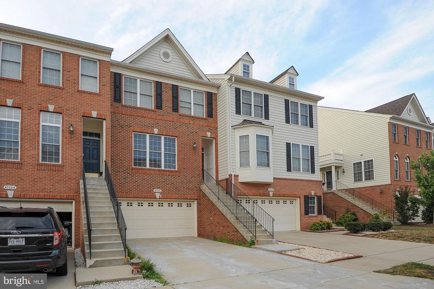 FRESHLY PAINTED. FRONT LOADING 2 CAR GARAGES, BEAUTIFUL 10+ HOME. NEW HOT WATER HEATER & HVAC.  BRIGHT, GRANITE COUNTERS, WOOD FLOORS ON MAIN & UPPER LEVEL. LARGE MASTER BR W/UPGRADED BA. GREAT LOCATION, STEPS TO UPPER SCALE SHOPPING, BUSINESS DISTRICT & MAIN ROADS.MANY AMENITIES, CLUB HOUSE, TOT LOT, TENNIS COURT, OUT DOOR S. POOL, LAKES, SOCCER FIELD