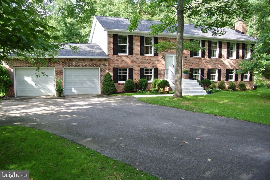 Extra wide stairs in the foyer create an open floor plan.  Updates throughout.  Gourmet kitchen with huge island.  New roof, New siding and new deck in 2017.  Huge family room with wet bar. Tastefully decorated. Move in ready.  Great commuting location.  Enjoy peaceful evenings on the rear deck overlooking your large back yard. Eligible for 100% financing thru USDA Rural Development if qualified.