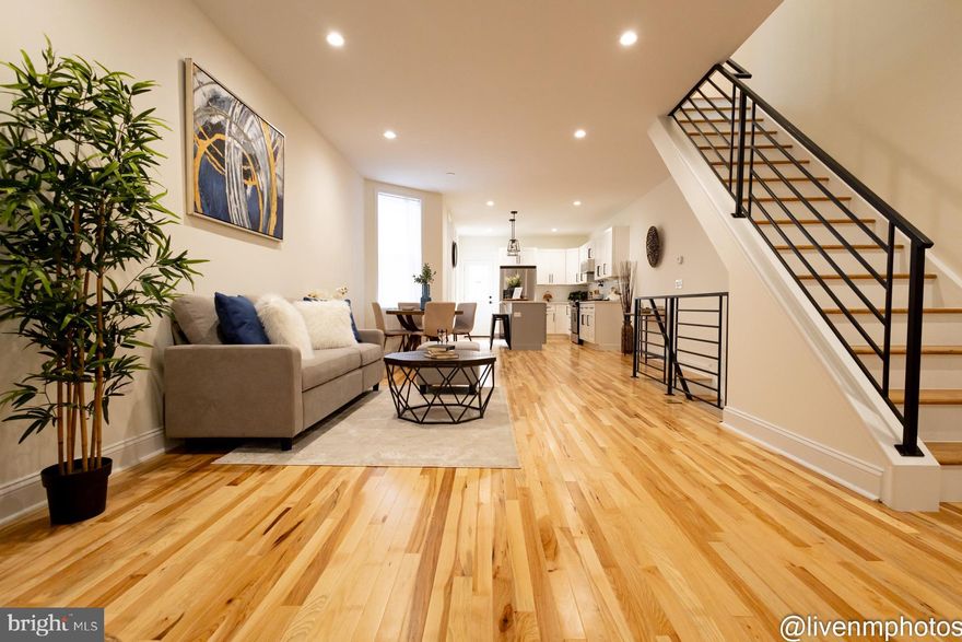 Welcome to this stunning townhouse at 1118 S. Paxon St, with its welcoming front porch which gives you a glimpse inside this charming residence. The townhouse offers a perfect blend of modern elegance and classic charm. This spacious home has an open floor plan featuring three bedrooms, two baths, and a convenient powder room. Step inside to discover gorgeous hardwood floors, a bright and airy living room, dining room, adorned with a plethora of windows, allowing natural light to fill the space. The heart of the home is the kitchen, with a chic eat-at island counter, white shaker cabinetry with black matte fixtures, boasting quartz countertops, stainless steel appliances, and a convenient pot filler for those large meals that you will enjoy preparing in this gourmet kitchen. Follow along the custom black wrought iron railings that lead you to the second floor. Upstairs, you'll find three generous bedrooms, including a luxurious master suite, sitting with a built -in fireplace private bathroom has a walk-in shower, frameless shower doors, porcelain tiles and a stylish wood bathroom vanity. The hall bath features a tub/shower combination and sleek porcelain tile, complemented by black matte fixtures for a touch of sophistication. The second bedroom is very spacious with ample closet space, ceiling fan and window that lets in the perfect amount of daylight. Walk to the rear third bedroom that can hold a queen-size bed and dressers, nice size closet and again that sunlight beams into the window bringing in warmth and joy. The wrought iron railings in hallway make for such an openness and spacious feeling. Head back downstairs to the lower level which offers an open- finished basement for entertaining and a cute powder room, plethora of closets & storage space, exposed black painted beams and a walkout to the backyard. Outside you will be greeted with this very cute backyard for amazing gatherings with friends and family. Don't miss the opportunity to make this beautiful townhouse your new home sweet home! There is an approved 10 Year Tax Abatement on this property.