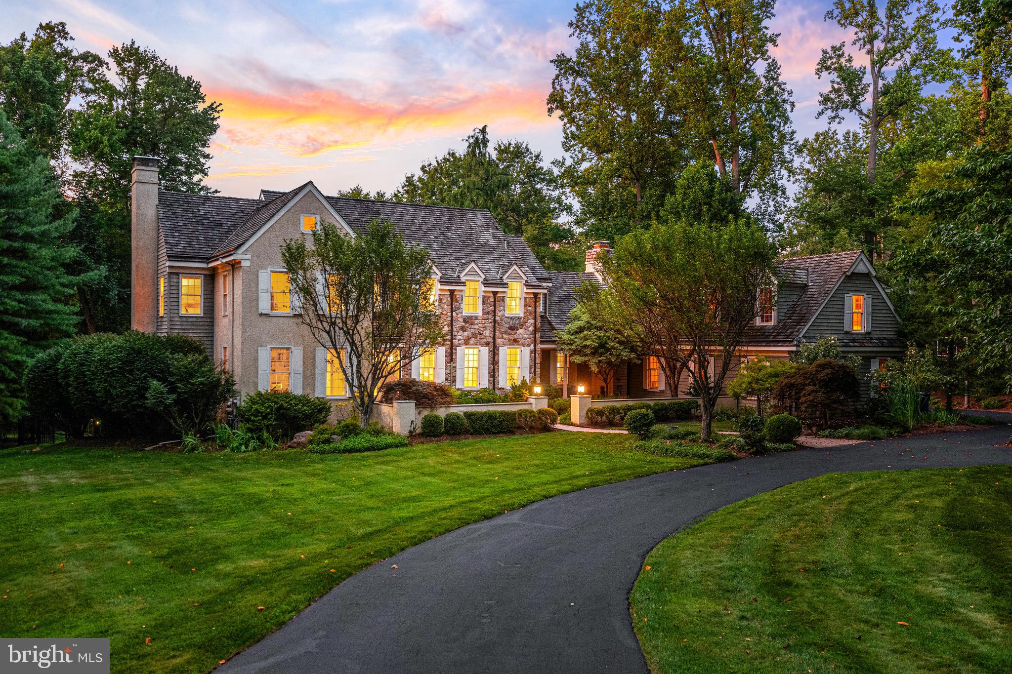 Welcome to 1285 Farm Road, a distinguished Pohlig-built resale on 1.3 private acres with a pool in the sought-after Leopard Farm enclave of Berwyn. Built in 1989 by one of the Main Line’s premier custom builders, this 6-bedroom, 4 full and 2 half bath residence includes a beautifully finished walkout lower level. Surrounded by mature trees and lush, year-round gardens—including specimen tree peonies at the front entry—it sits within the top-ranked Tredyffrin-Easttown School District.
Tucked into a sought after neighborhood of large lots, the property offers the perfect balance of privacy and convenience, with easy access to Rt 252, Leopard Rd, Sugartown Rd and nearby schools, shops, and dining. Set back from the road, the home is approached through a winding driveway with lots of privacy andparking and beautifully landscaped courtyard entry and surrounded by thoughtfully designed gardens. These outdoor elements set the tone for the gracious interiors that follow. Inside the home features light filled rooms, complemented by high ceilings, detailed millwork, and rich hardwood floors.
The classic center hall design features a welcoming foyer flanked by a sunlit dining room with a bowed window and a formal living room with fireplace and marble surround. The library/home office/den offers a peaceful retreat overlooking the expansive front lawn—ideal for working from home. At the heart of the home is the spacious, open-concept kitchen and great room. The kitchen includes a Sub-Zero refrigerator, stainless steel appliances, large center island, peninsula seating, walk-in pantry, and built-in desk surrounded by custom cabinetry. A butler’s pantry connects to the dining room, and the adjacent breakfast room opens to the rear deck via French doors. The great room features vaulted ceilings, dramatic floor-to-ceiling stone fireplace, and a wall of windows overlooking the backyard and French doors that open to the deck. These three spaces—kitchen, breakfast room, great room—flow effortlessly together for a layout that invites connection and comfort. Backstairs are located here. The main level also includes a mudroom, two powder rooms, and a large laundry room with granite counters and cabinetry.
Upstairs, the primary suite is a private retreat with two walk-in closets, and a large spa-style bath featuring double vanities, a soaking tub, and a separate shower. Bedroom 2 enjoys an en-suite bath, while Bedrooms 3 and 4 share a well-appointed Jack-and-Jill bath with dual vanities. A bonus room right next to the primary suite with a soaring ceiling and built-in sink offers flexible space—used as an art studio, this could be a 5th upstairs bedroom.
The finished walkout lower level includes an additional bedroom, full bath, gym area, and a media/bonus room. A built-in bar w/ granite counters, wine refrigerator, and a stone feature wall makes it ideal for entertaining, while a separate area is perfect for ping pong, movie nights, or sleepovers. It also provides direct walk-out access to the pool. Large windows, recessed lighting, and a mix of tile and carpeted flooring bring comfort and flexibility to this well-designed level.
From the mudroom door, through a charming breezeway, enter the oversized 3-car garage with stairs to a large unfinished space above, ideal for creating another living suite, an office, home gym or studio.
Outdoor living is equally impressive: a multi-tiered deck, tiled patio, mature landscaping, and shaded areas surround the in-ground pool and spa, creating a peaceful oasis.
Located in award-winning T/E Schools - minutes to Beaumont Elementary, Episcopal Academy, and Paoli Train Station (with service to NYC and Center City Phila.), this home also provides easy access to Route 30, 252, and 202, and is convenient to shopping and dining in Berwyn, Paoli, Devon, Newtown Sq and more.
1285 Farm Road, Berwyn offers a serene setting, timeless design, and exceptional livability—all in the heart of the Main Line.