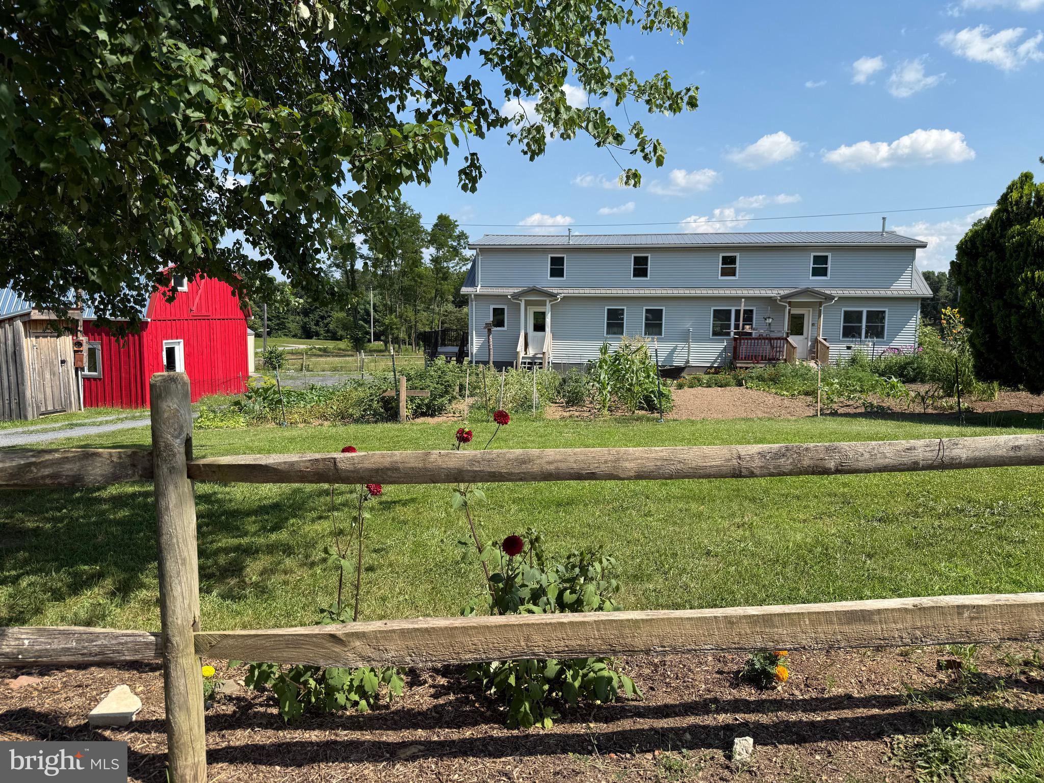 Call today to see this beautiful Amish built home with a barn on 3.29 acres in Levels, WV. This large home was built in 2022. It was designed with an in-law suite that has one bedroom, one bathroom, a complete kitchen and its own entrance on the right half of the main floor. The main floor is divided by only a door so you can easily redesign the layout to your tastes. The main floor in whole has 2 bedrooms with partition walls that can be removed to create more open space, 2 full bathrooms and 2 full kitchens. The right half of the space features large, dark stained custom built cabinets in the kitchen and another room that can be used as another bedroom, office or bonus room. There is a back deck on the right and a side deck on the left. Glass pane double doors lead to the stairs that take you to the upper floor. There you will find 5 very spacious bedrooms and linen closets on each end of the hallway. There are also 2 storage spaces making maximum use of the space. The basement feels comfortable and is a great open space with large windows that let natural light just pour in. It is a blank canvas waiting for you to bring your vision to fruition. There is also a small room dedicated as a cold storage space for canned goods. This Amish home provides a unique opportunity that will allow you to live a self sustainable lifestyle and off the grid, or you can customize an electrical system tailored to your wants and needs. The barn features a hayloft and a stall where you can keep your horse or other animals. The mostly level fenced-in land is currently used as a pasture, but you can create a great outdoor space or build that garden you've always wanted. You can find peace and privacy of living in the country and convenience. You are located less than 20 minutes from town where you can shop and dine. It is also less than an hour's drive from Winchester, VA or Cumberland, MD.