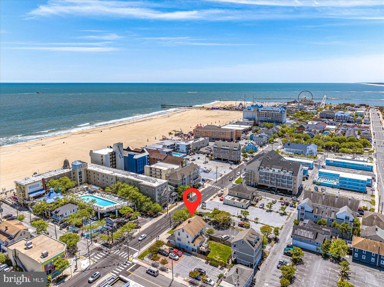 Don't miss your opportunity ½ block to the beach Oceanside!!! Now is your chance to own this Mixed-use property in the heart of Ocean City. Currently the home is being used as a second vacation home. The home has 5BR/4BA with 2 living areas, fireplace and expansive dining and kitchen area. There is plenty of parking in the back of the property. This home is zoned DMX/Downtown Mixed-Use District which allows for commercial use. There is enormous opportunity for redevelopment. This home is close to the Ocean City Boardwalk, beach, restaurants, shops and the bay. Come take a look before it's SOLD!