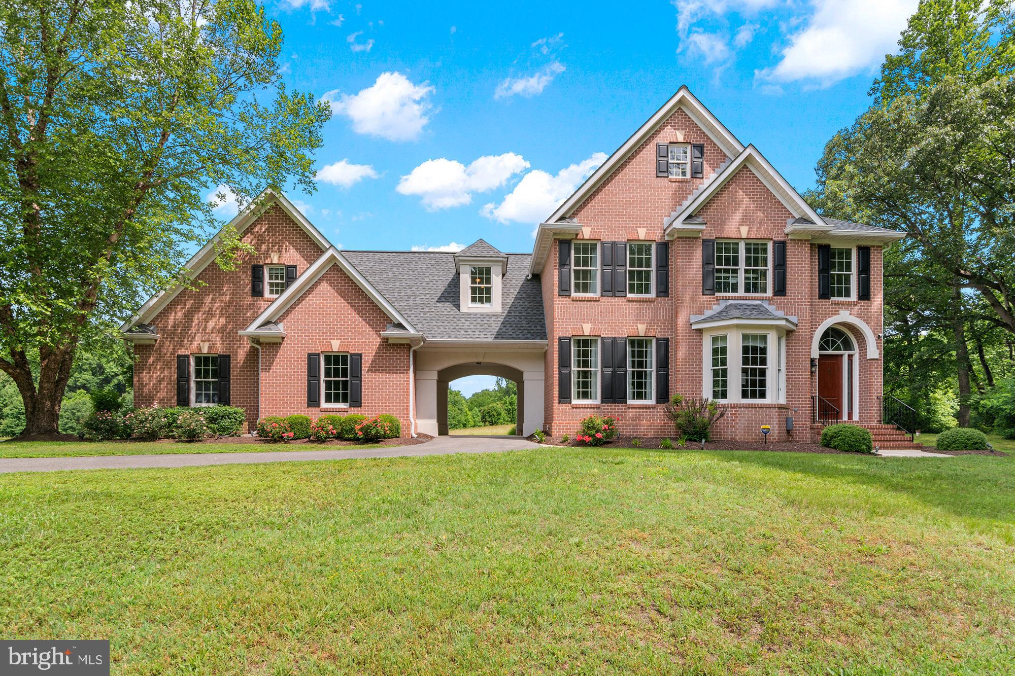 Welcome Home to 2008 Martins Grant Court! Every detail was carefully considered in this meticulously maintained and updated Colonial. Spacious living room with gas fireplace opens to patio (2021) and 2 acres of private yard. Eat in kitchen updated in 2014 with wall oven and microwave upgrades in 2020. Mini-bar with custom cabinets and wine fridge. Dining room with additional sitting area. Beautiful hardwood floors throughout (2019). Primary bedroom with walk in closet, soaking tub, dual vanities, shower, private toilet and bidet. Ensuite with full bath (updated 2024), new carpets and paint (2025), and double closets on bedroom level. Laundry on bedroom level. Hall bath updated in 2021. Finished basement (2021) features wet bar with refrigerator, sink, and microwave; full bathroom; and room that could be a fifth bedroom. Well on reverse osmosis water system. Dual zoned heating and AC (2014). Driveway redone in 2019 and retaining wall in 2021. Roof replaced in 2019 with 50 year shingles. 2 car garage with carport coverage for side door. Home is situated on a quiet court with no thru-traffic, and still conveniently located just minutes from Waugh Chapel Shopping Center, and Routes 3 & 97 making it very commutable to DC, Annapolis, and Baltimore.