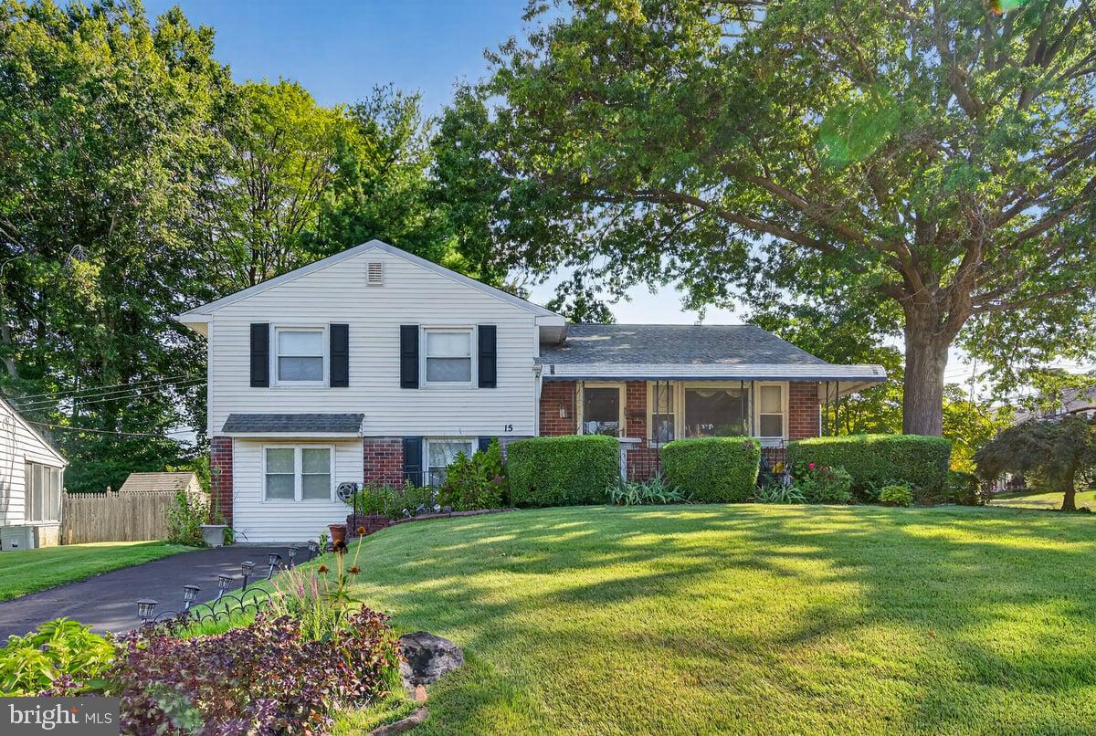 Welcome to this beautifully maintained bi-level gem nestled on a spacious corner lot, just a short stroll from the local swim club. This inviting residence offers the perfect blend of comfort, style, and versatility. This home boasts beautiful hardwood floors on the main and upper levels. A sun-drenched bay window fills the main level living space with natural light. The updated kitchen featuring sleek cabinetry, contemporary appliances, and ample counter space—perfect for entertaining or quiet family dinners. Upstairs boasts three generously sized bedrooms with full bath. The finished above-ground basement is justs a few steps below the kitchen level and is right off of the with a bonus room that can adapt to your lifestyle. Use it as a home office, gym, guest bedroom, or playroom—the possibilities are truly endless. Home is being sold "As Is"