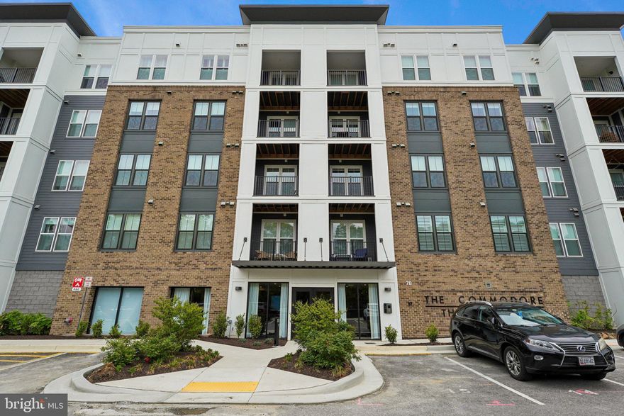 Step into sophisticated comfort in this exceptional third-floor corner residence, a 2024-built condominium offering 1,723 square feet of thoughtfully designed space filled with natural light and showcasing designer finishes, premium upgrades, and meticulous attention to detail throughout. Located within a desirable 55+ active adult community, the open, well-appointed floor plan includes two spacious bedrooms, two full baths, and a private study—perfect for today’s flexible lifestyle. The gourmet kitchen stands out with high-end appliances, upgraded cabinetry, and elegant finishes, ideal for both everyday living and entertaining. Freshly painted and professionally styled, the home features new designer lighting and custom closet systems for added sophistication and functionality. Step outside to a private balcony—perfect for enjoying warm summer days, morning coffee, or evening relaxation. A rare highlight is the combination of two highly sought-after features: a private storage unit, reserved garage parking, an uncommon offering that adds significant value. Enjoy the added benefit of a low condo fee, enhancing both affordability and long-term value. Residents enjoy resort-style amenities, including pickleball courts, scenic walking trails, a golf simulator, dog park, and inviting indoor and outdoor gathering spaces with grilling areas, all ideally located with a quick drive to downtown Annapolis, waterfront dining, shopping, and the Bay Bridge. Impeccably maintained and move-in ready, this residence offers a unique opportunity to own a beautifully upgraded home with exceptional parking and storage in a vibrant, amenity-rich community.