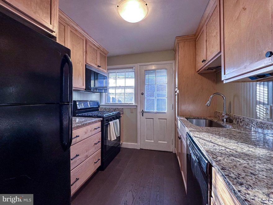 Welcome to this beautiful end-of-row brick townhome that blends classic charm with modern updates. The home features gorgeous hardwood floors that add warmth and character throughout the living spaces. The newly remodeled kitchen offers stylish granite countertops and lightly stained cabinetry, creating a bright and inviting space for a back of home entry and cooking. 

In addition to the interior upgrades, this property includes a detached two-car garage with convenient access from a private alley, providing both functionality and privacy. Natural gas heat and hot water add efficiency and comfort year-round.

This well-maintained home is the perfect opportunity for buyers looking for quality updates and timeless appeal. Schedule your private showing today. Microwave to be replaced!