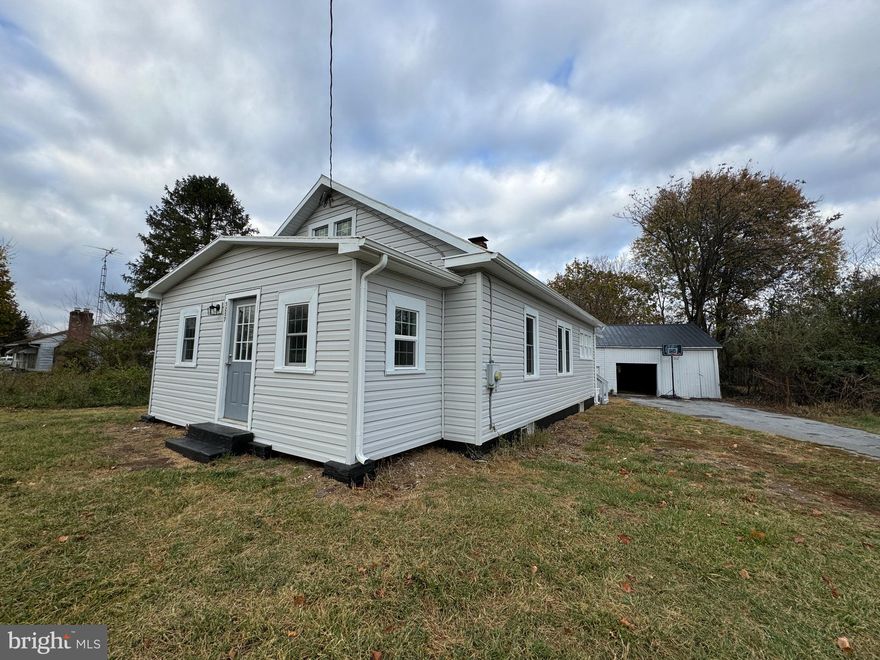 Back on the market due to no fault of the seller! Welcome home! Take a look at this cozy updated rancher in Inwood. This home boasts brand new vinyl siding and windows. Fresh paint and new floors make it ready for you to move right in. You can enjoy your morning coffee or evening dinner in the sunroom at the front of the house. The outdoor building and unfinished basement provide ample space for storage or work space. Make sure to come see this one!