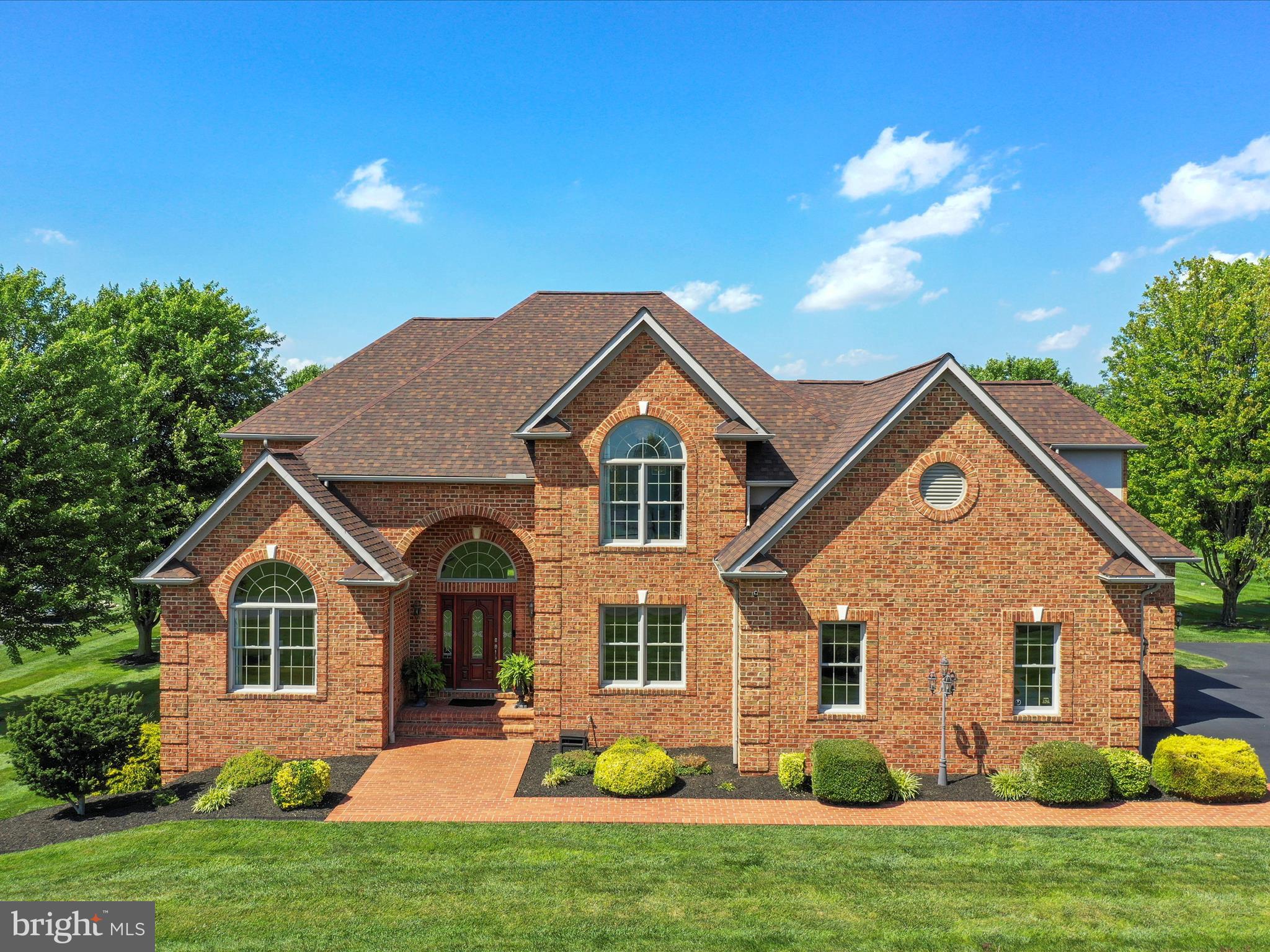 Welcome to this stunning, custom-built all-brick estate offering nearly 5,500 square feet of elegant living space, meticulously maintained inside and out. From the moment you arrive, you’ll be captivated by the craftsmanship, thoughtful design, and exceptional amenities that define this one-of-a-kind residence.
Step inside to find a seamless blend of sophistication and comfort, with spacious living areas ideal for both everyday living and grand entertaining. The heart of the home is the family room, where a beautiful stone fireplace creates a warm and inviting atmosphere. The gourmet kitchen and formal dining areas flow effortlessly into the expansive deck and patio spaces, perfect for indoor-outdoor living. Also, on the main level you'll enjoy the stately office, spacious bedroom and separate laundry room.
Step into the upper level of this exquisite home and discover a sophisticated primary suite designed for comfort and elegance. The expansive primary bedroom features a lighted tray ceiling that adds a touch of ambient luxury, while large windows flood the space with natural light. A generously sized walk-in closet offers ample storage and organization.
The spa-inspired primary bathroom invites relaxation with a jetted soaking tub, a separate walk-in shower, and high-end finishes that create a tranquil retreat.
Three additional spacious bedrooms provide comfort for family or guests, with a well-appointed Jack and Jill bathroom connecting two of the rooms. Currently, the attached bedroom is the dedicated fitness room which completes the upper level—perfect for maintaining a healthy lifestyle without ever leaving home.
The fully finished walkout basement offers an upscale retreat of its own, complete with elegant living quarters ideal for extended stays or entertaining, designed with the same high-end finishes found throughout the home. The heated garage features epoxy-finished floors, adding both function and flair for the car enthusiast or hobbyist.
Outdoors, enjoy resort-style amenities including a luxurious inground heated pool, a charming pool house, outdoor fireplace for cool nights and a versatile, lighted sport court perfect for pickleball, volleyball, or badminton. Whether you’re hosting gatherings or enjoying a quiet retreat, this backyard oasis has it all.
Additional highlights include a new roof, multi-zone climate control, outdoor lawn equipment and tool storage shed and custom details throughout. Beautiful mountain and county views surround the estate, conveniently located mere minutes from Meritus Medical Center and commuter friendly location to close to interstate access, restaurants and shopping. This home is a rare blend of luxury, comfort, and recreation—crafted for those who appreciate the finest in design and lifestyle.
A true gem—inside and out.