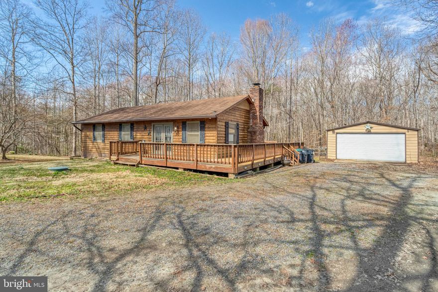 Don't miss your chance to own this charming main-level living rambler!  Featuring three spacious bedrooms, two full baths, a dedicated laundry room, and a cozy wrap-around porch for those relaxing evenings under the stars and extra entertaining space.  The fenced-in backyard provides privacy, while the large detached garage adds extra storage and functionality.  Don't let the "Sold As-Is" deter you-bring a paintbrush and some beautiful Benjamin Moore paint colors, and this diamond in the rough will truly shine.