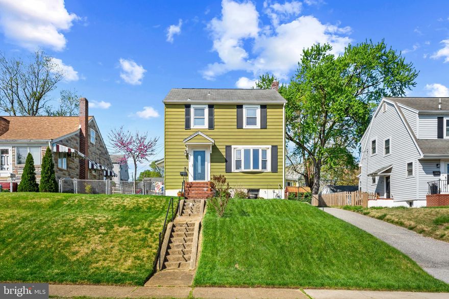 Charming Colonial residence offers 1,440 square feet, 3 bedrooms, 1 full bath, and 1 half bath in desirable Oakland Terrace. A traditional floor plan begins with gleaming hardwood floors that flow through the foyer into a sunlit living room, brightened by large bow windows. A graceful arched doorway leads into the formal dining room, accented by a timeless chandelier. The thoughtfully designed eat-in kitchen features durable LVT flooring, stainless steel appliances, a breakfast bar, a pantry, and plenty of cabinet and counter space. Upstairs, you'll find three generously sized bedrooms with hardwood floors and a well-appointed full bathroom. The finished lower level offers a flexible family room, a laundry area with a dedicated workshop space, a half bathroom, and a 3x4 walk-in closet for extra storage. Enjoy the outdoors in the fenced, level backyard with an open platform deck and a cozy fire pit area.