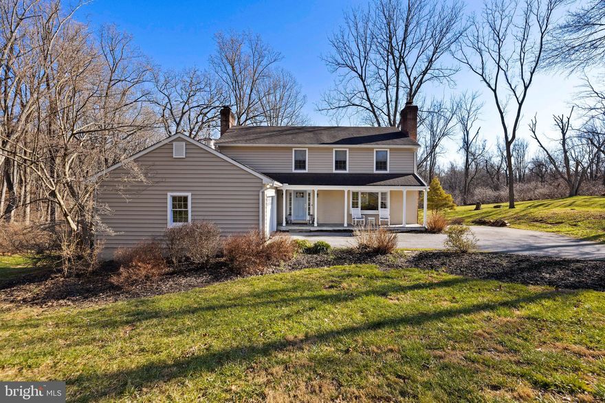 Beautifully Updated and Maintained Colonial in the "Ravenhurst" Neighborhood. Situated on a 1.17 Acre Lot sits this 4 bedroom, 2/2 Bath Home with a 2 car Garage. Main Level Features Living & Dining Rooms with Crown Molding, Bay Windows and Wood Burning Fireplace. Bright and Spacious Kitchen with Custom Cabinetry, Stainless Appliances, and Center Island  Opening to the Family Room w/ Fireplace and Custom Built-Ins . In Addition, there is a  Powder Room & Mudroom with Built-in Cubbies  and Access to Garage.  The Upper Level  Features a Lovely Primary Suite with Sitting Area & Fireplace as well as Remodeled Bath & Walk in Closet.  Upper Level also includes 3 Additional Nice Sized  Bedrooms and Remodeled Hall Bath. The Lower Level has a Rec Room, Office, Powder Room and Offers Plenty of Storage. Enjoy the Expansive Rear Deck Overlooking Private Backyard or the Lovely Covered Front Porch.  Very Private and Serene Location yet Minutes to Everything!