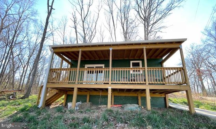 Come see this cute home on one acre close to the town of Front Royal and all of its amenities! This home was rebuilt just 3 years ago and is perfect for a weekend getaway place or for someone that wants a place to bring their pets and enjoy the outdoors with one acre! You can enjoy the skyline from the spacious covered front porch or the wraparound patio in the back. Enjoy cozy winters with the pellet stove or the outdoor activities in the warmer months! Immediate occupancy is available. Call for details.