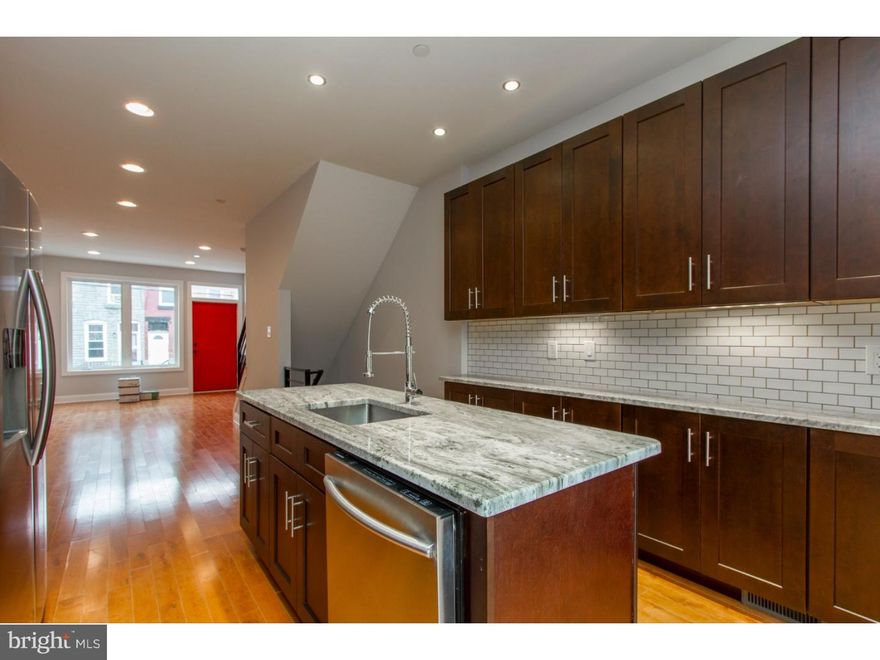 A new construction home you'll adore! This home includes features you'll adore, including hardwood flooring, recessed lighting, high ceilings and large windows for ample natural light. The open living area leads to a full dining room then gorgeous modern kitchen, complete with granite counters, stylish cabinetry, stainless steel appliances and a tiled backsplash. Continue through the kitchen and charming breakfast area and check out the deck and rear yard- just the spot for those summer barbecues! Upstairs, the second floor reveals two sundrenched bedrooms with ample closet space, Sliding doors with Juliet Balcony, laundry room and a conveniently located, tiled hall bath. The third floor includes an office space and master suite which is also a delight, with its hardwood flooring, walk in closet, sliding doors to another Juliet balcony and master bath with tiled flooring, separate tub and tiled shower, and a beautiful dual vanity. From the master suite, climb up to the immense roofdeck, which showcases gorgeous views of the city. Still need extra room for a home theater or guest bedroom? The finished basement is just the space you're looking for, and even includes a full bathroom for your comfort and convenience. Take advantage of this opportunity now and add your own personal style to the home, choosing from a wide selection of options in finishes, home automation systems, wet bar and more. Found on a charming residential street, what are you waiting for? See this home today! Photos are of a home by the same builder.