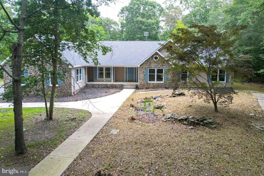 LOOKING FOR PRIVACY!!!! Discover the charm of this beautifully renovated ranch-style home nestled on a sprawling 23.6-acre wooded lot. This inviting residence offers a perfect blend of modern comfort and serene rural living, making it an ideal retreat for those seeking tranquility and space. With 4 spacious bedrooms and 3 full bathrooms, this home is designed for both relaxation and entertainment.  Home features a formal dining room, den and a large office area with separate exterior entrance, which would be perfect for your home-based business. The heart of the home features a cozy fireplace with woodstove insert, perfect for gathering with loved ones on chilly evenings.  You’ll love the spacious new kitchen with all new cabinets, granite countertops and appliances which feature a double wall oven, as well as an electric range with oven.  Kitchen also has a large center island with breakfast bar.  The 1500sq ft sunroom with heat and AC seamlessly connects the living areas, allowing for effortless flow and natural light to fill the space. Enjoy breathtaking views of the surrounding trees and woods, providing a picturesque backdrop for your daily life. The property boasts ample parking with a side-entry 3 car attached garage.  There is also a 40’x 90’ pole building with 5 oversized doors and 10’x 90’ lean to off the back.  Want to raise your own chickens for eggs?  There is a chicken coop all set up for you.  Located in a peaceful rural setting, this home offers the perfect escape from the hustle and bustle while still being conveniently accessible. Whether you’re looking to unwind in nature or host gatherings, this property is designed to meet your needs. Embrace the opportunity to make this stunning home your own, where comfort and nature harmoniously coexist. Don’t miss out on this unique chance to own a piece of paradise!