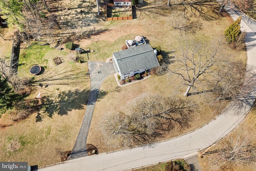 This beautifully updated 4 bedroom, 2 bath ranch-style home offers so much more than meets the eye on a huge piece of usable land with plenty of space inside and out. The front of the home has a private covered front porch, ideal for a serene cup of coffee that leads to the front entrance.  

Enter the large living room with lots of natural light, a brick fireplace and built in bookshelf accent.  The gleaming hardwood flooring of the living room flows nicely into a bright, open dining area with access to the expansive trex deck by way of newer sliding glass doors, an ideal space for outdoor dining, gatherings, or simply relaxing while overlooking the yard.

The heart of the home is the renovated kitchen (2017), thoughtfully opened up to create a bright, inviting space with ample seating—perfect for everyday living and entertaining. This space features stainless steel appliances, granite countertops, 42in shaker cabinets and blue subway tile backsplash.

Further into the home, the main level also features four generously sized bedrooms and two full bathrooms, providing comfort and flexibility for family, guests, or home office needs.

Downstairs, the finished basement expands your living space with two distinct living areas with luxury vinyl plank flooring throughout—perfect for a recreation room, media space, gym, or playroom. This level also offers convenient walk-out access to the driveway, interior access to the garage, along with a dedicated laundry area and plenty of storage.

Ideally located in the desirable Garnet Valley School District, this home is just minutes from Route 202 and Route 1, offering easy access to a wide variety of shops and restaurants. Commuters will appreciate the quick connection to I-95, making travel to Philadelphia or Delaware simple and convenient.

Septic and Well replaced in 2013.  Other mechanical upgrades include (but not limited to) replacement windows, all new siding, a hot water boiler (2023), a new washer/dryer (2024), a reverse osmosis system (2024).  See documents section of MLS for additional history.

A wonderful combination of modern updates, functional layout, and indoor-outdoor living—this home is ready to enjoy.