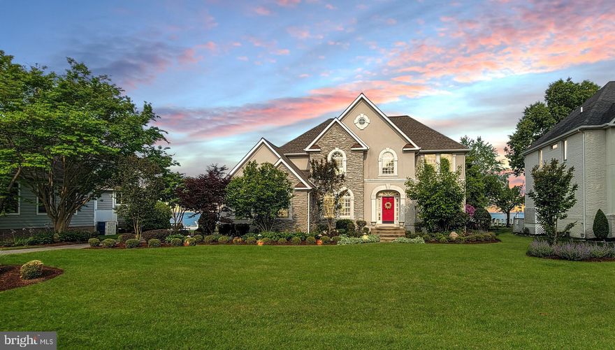 This stunning waterfront home on the banks of the Potomac River is resort living at its absolute best!
From the spectacular sunsets to having the feeling of living on vacation year-round, it just doesn’t get any better.   This home boasts an open floor plan with 2 family rooms, 5 bedrooms, 3 full bathrooms and a 3-car heated garage.  Walking into the main level of this home you are met with beautiful oak plank hardwood floors throughout, a large foyer, 20 foot ceilings, the formal dining room with a wet bar and a view of the Potomac River that pulls you into the gourmet kitchen with a large island, desk and eat in space.  There is a large pantry with an extra refrigerator off the kitchen that is hidden behind a beautifully restored sliding barn door.  Your gourmet kitchen is open to the family room with a stone surround gas fireplace.  Enjoy making meals and entertaining while watching all the Potomac River has to offer.  There are 2 bedrooms and a full bathroom on this level for guests and or an office.  Walk through the double sliders from the living room and step down to a covered stone patio with a privacy wall to the first of 4 outdoor seating areas.  On the other side of the home is a raised deck looking directly down the pier and covered by an umbrella of crape myrtle trees that cannot be beat for the Maryland pastime of crab eating and summer cookouts.
Walk upstairs to the second family room and enjoy the expansive views of the Potomac River.  Walk through the dual sliding doors to the upper-level deck large enough to entertain a substantial size party, or to lounge on your deck chairs enjoying a glass of wine and watching the sunsets or the wildlife on the river.  The primary suite for this home is found on this level using the left side of the home.  It boasts a large bedroom with stunning views of the Potomac, an en suite with an oversized jetted tub, a large separate walk-in shower, double vanity with dual lighted mirrors and a customized built-in closet and dressing room with the laundry room attached.  The other 2 bedrooms and full bathroom are also found on this level and on the right side of the home.  A few of the recent upgrades include a new roof, newly encapsulated crawl space, new 15,000 lb. boat lift, new jet ski/kayak lift, new refrigerator and dishwasher and topped off with a kitchen faucet that you turn on and off with the wave of your hand. The grounds around the home are professionally landscaped with flowering plants timed to cycle throughout the season, and an in-ground sprinkler system with landscape lighting. Walking out to your private, lit pier, the deck on the end has a ladder to the water, and chairs secured on the deck for year-round waterside chats just steps from your beautiful home. This beautiful home is located in the Yacht and Country Club community of Swan Point. The community amenities to be enjoyed include an olympic size waterfront pool, a private marina with kayak launch, tennis and pickleball courts, playground, newly renovated walking trails with dog stations, a sandy picnic area looking out on the Potomac River, a beautiful 18 hole golf course recognized as one of the top courses in the mid-Atlantic area, along with a putting green and driving range to sharpen your golf game.  The Country Club's restaurant offers a wonderful family outing for nights when you don't feel like cooking or you may enjoy one of the many planned wine tastings, painting parties, murder mystery dinners, Sunday brunches or the Summer Concert Series on the veranda. Don’t forget the newly opened Osprey Bar on the creek by the marina.  Also opening soon will be beach access with recurring events and amenities provided by the club and open to all homeowners. If you are looking for the perfect waterfront home for your retirement, a home for your family, or perhaps a second home that gives you all of the privilege which come with this property, don't miss this chance to make it yours.