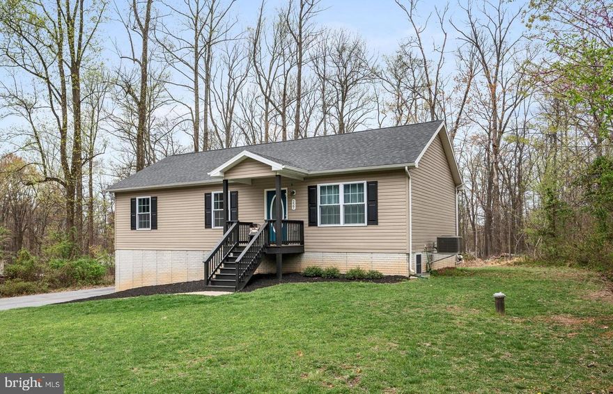 This modern raised rancher with a full finished basement and spacious screened porch is now available in Shannondale. Built by a local custom builder, this fresh and beautiful home features an open floor plan with a living and dining area that highlights the vaulted ceilings, views of the expansive screened porch, and an oversized lot offering forested privacy. New paint 2021, new water treatment system, and new appliances 2019, septic pumped October 2024. The lower level includes a one-car garage, a rec room, an office, a third full bathroom, and plenty of handy storage. Experience the peaceful joys of mountain living while still being within easy commuting distance to northern VA.